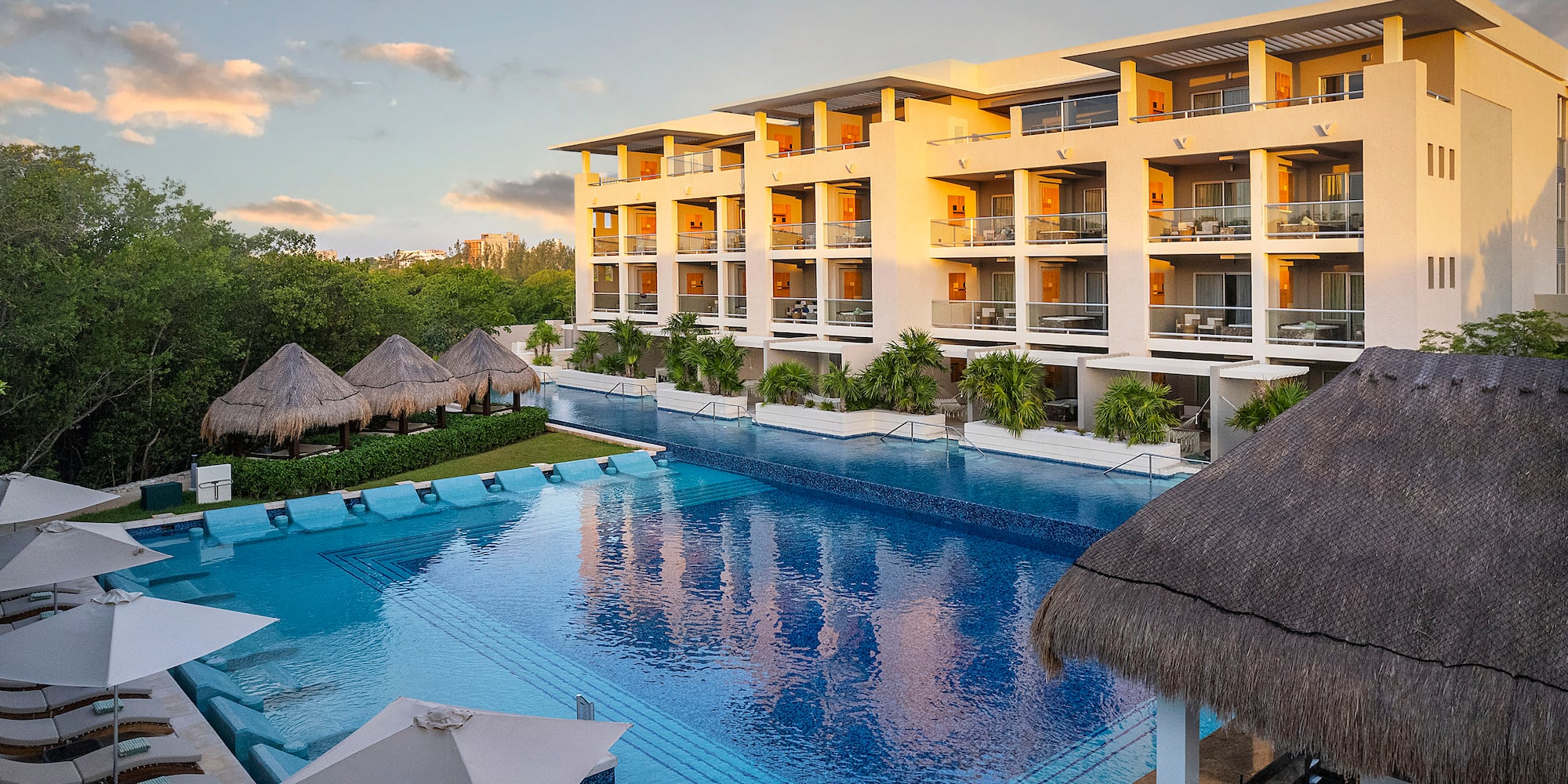 a pool with a building and trees