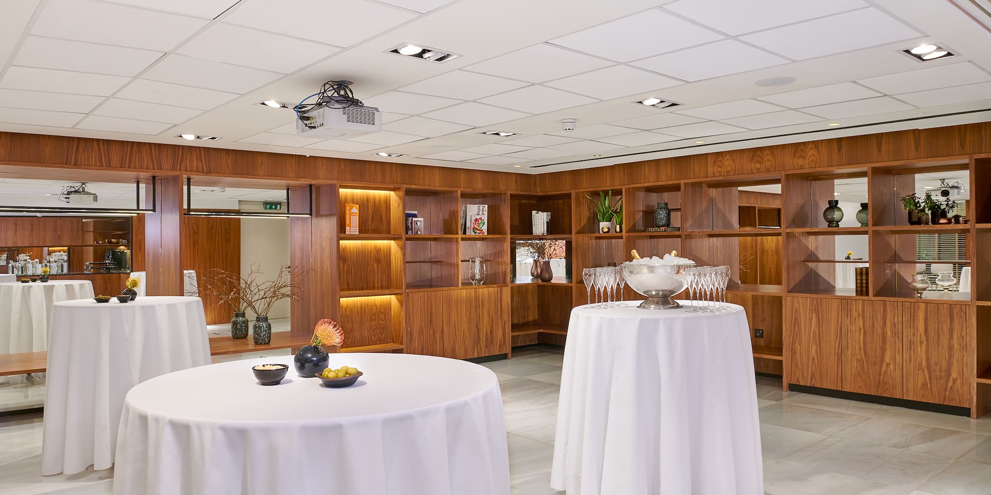 a room with tables and shelves