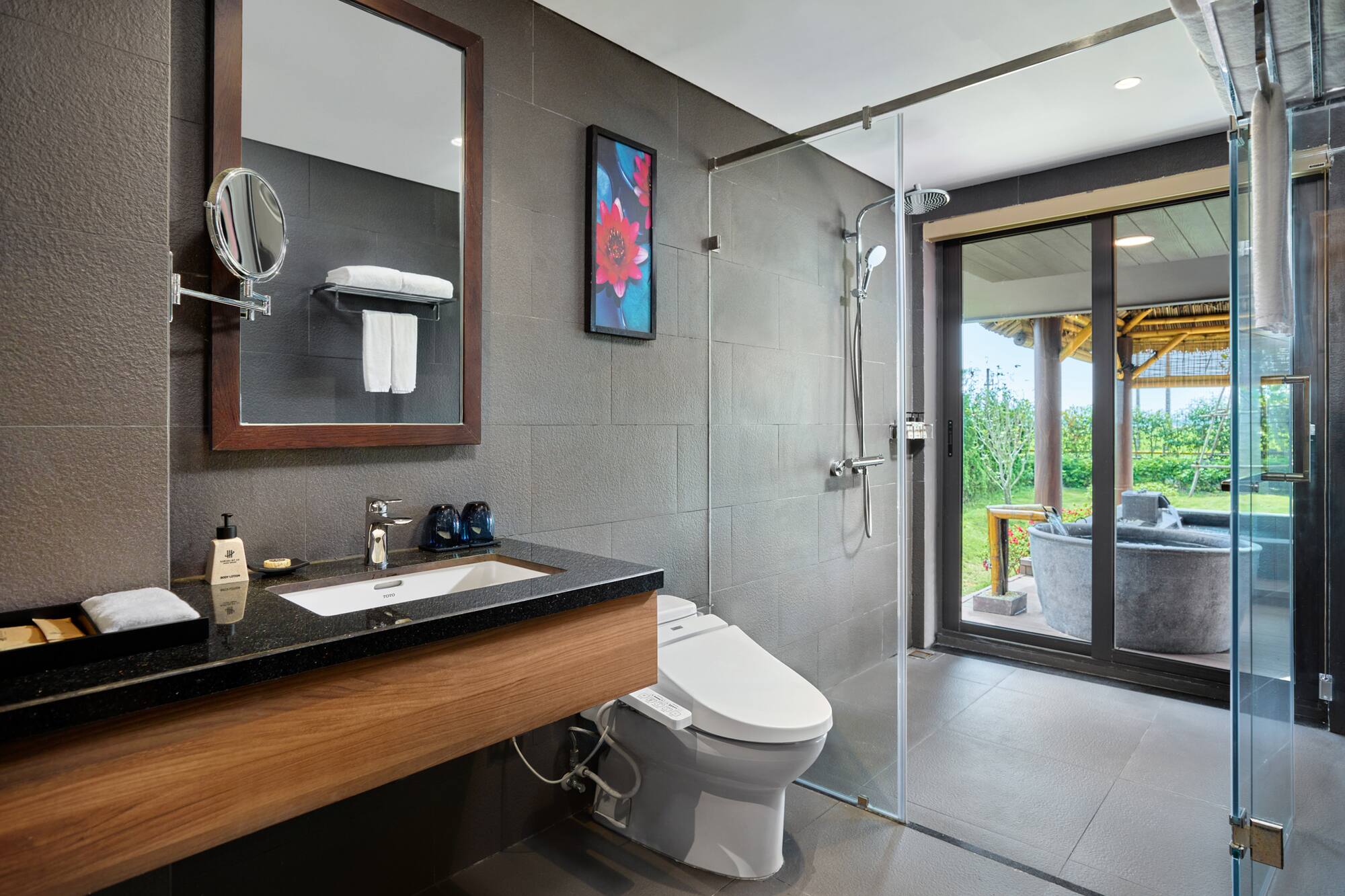 a bathroom with a shower and a toilet