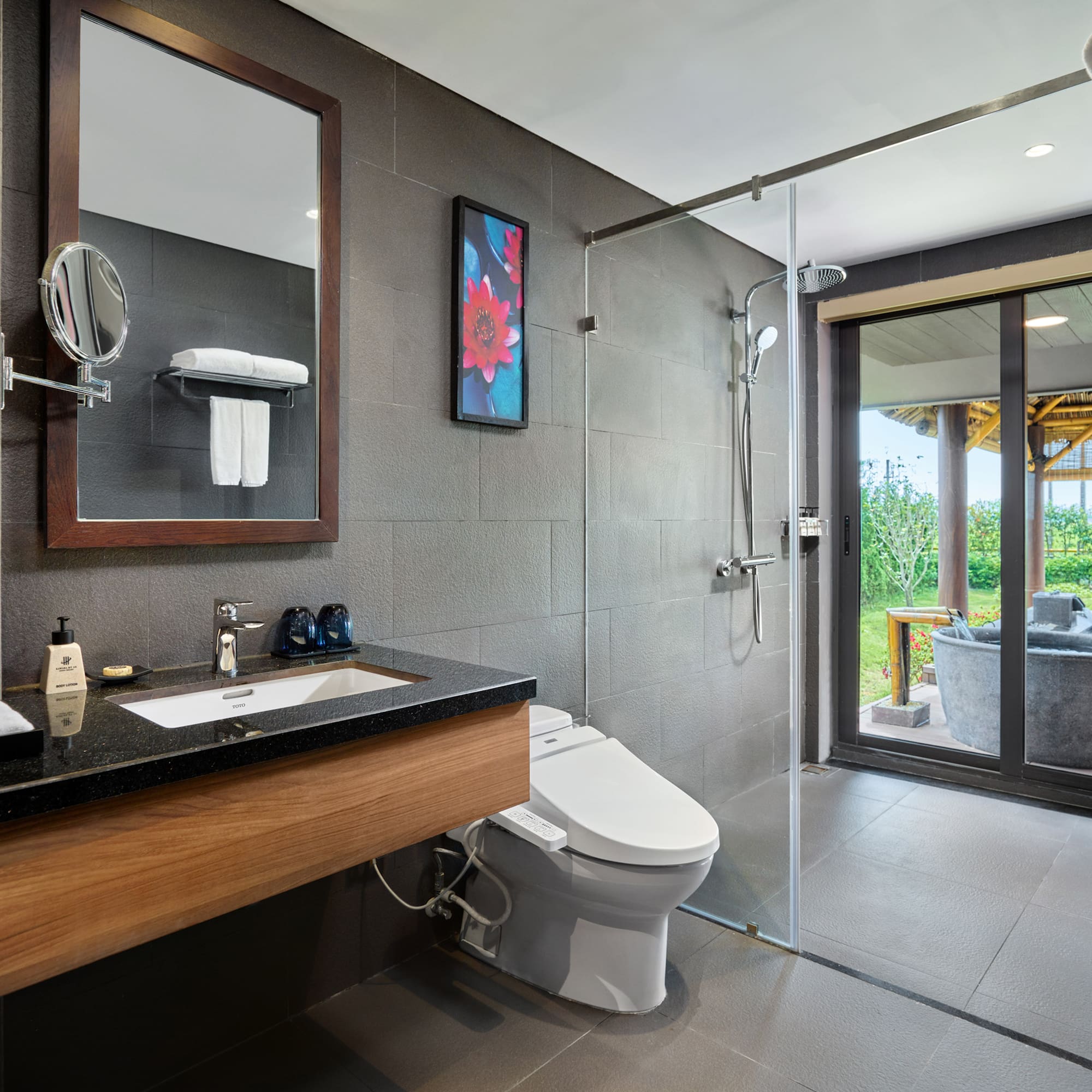 a bathroom with a shower and a toilet