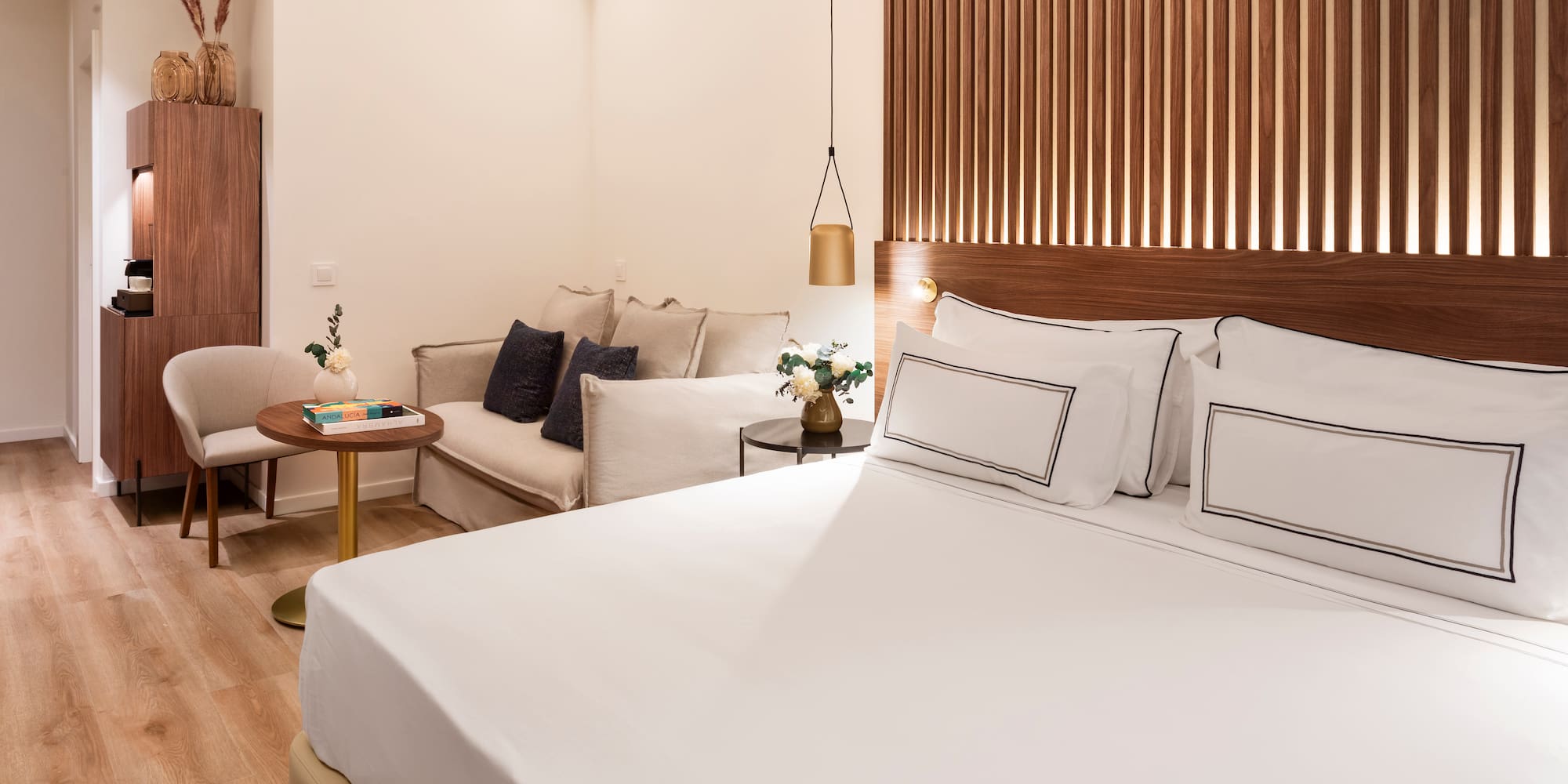 a room with a bed and couches