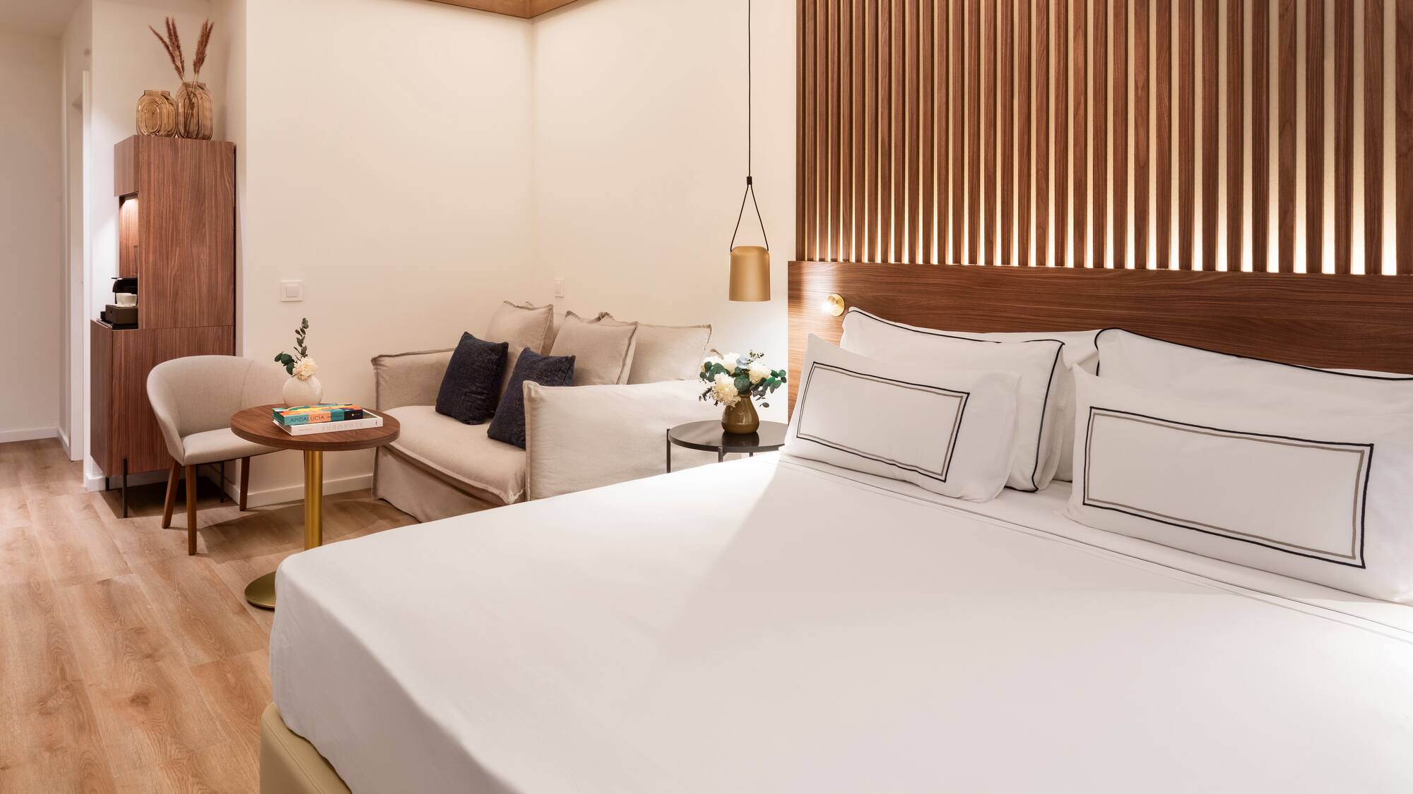 a room with a bed and couches