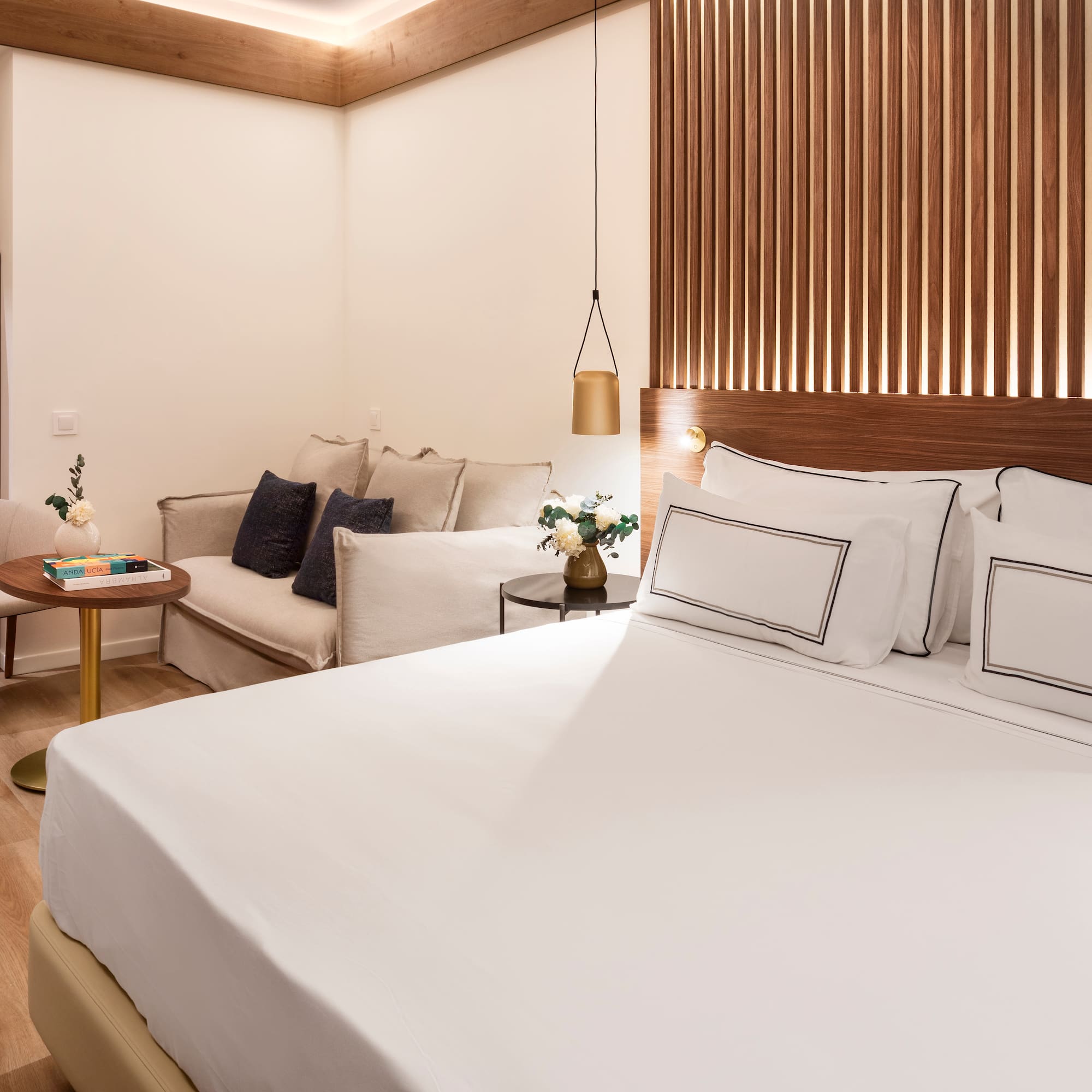 a room with a bed and couches