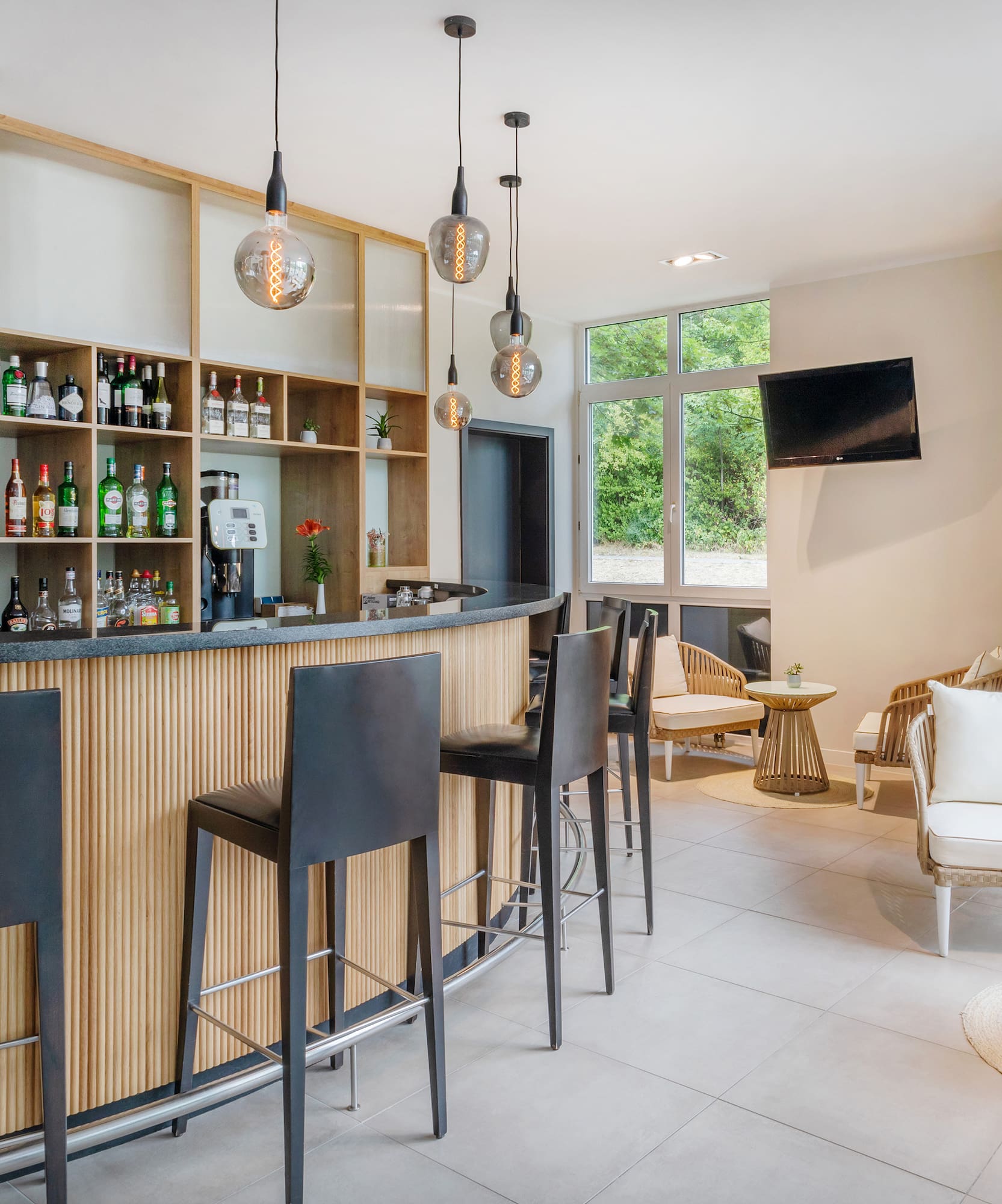 a bar with a counter and chairs