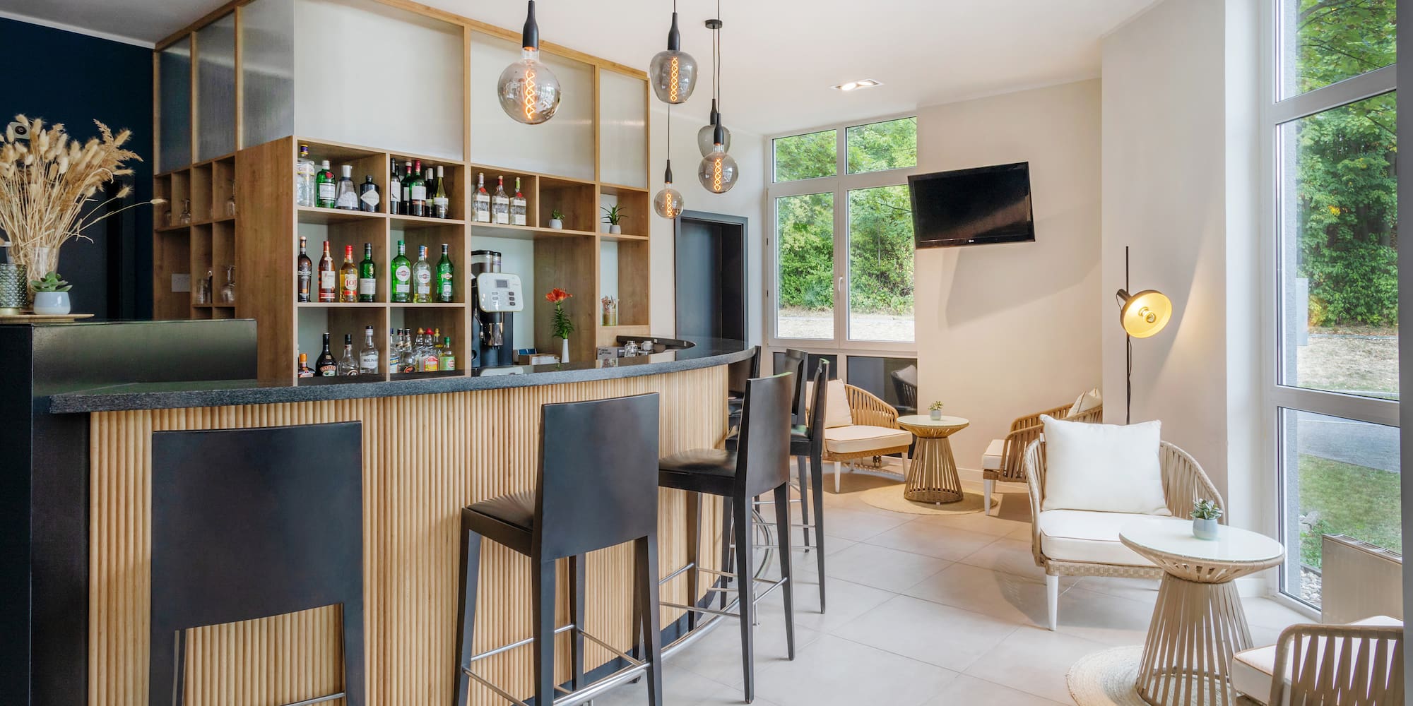 a bar with a counter and chairs