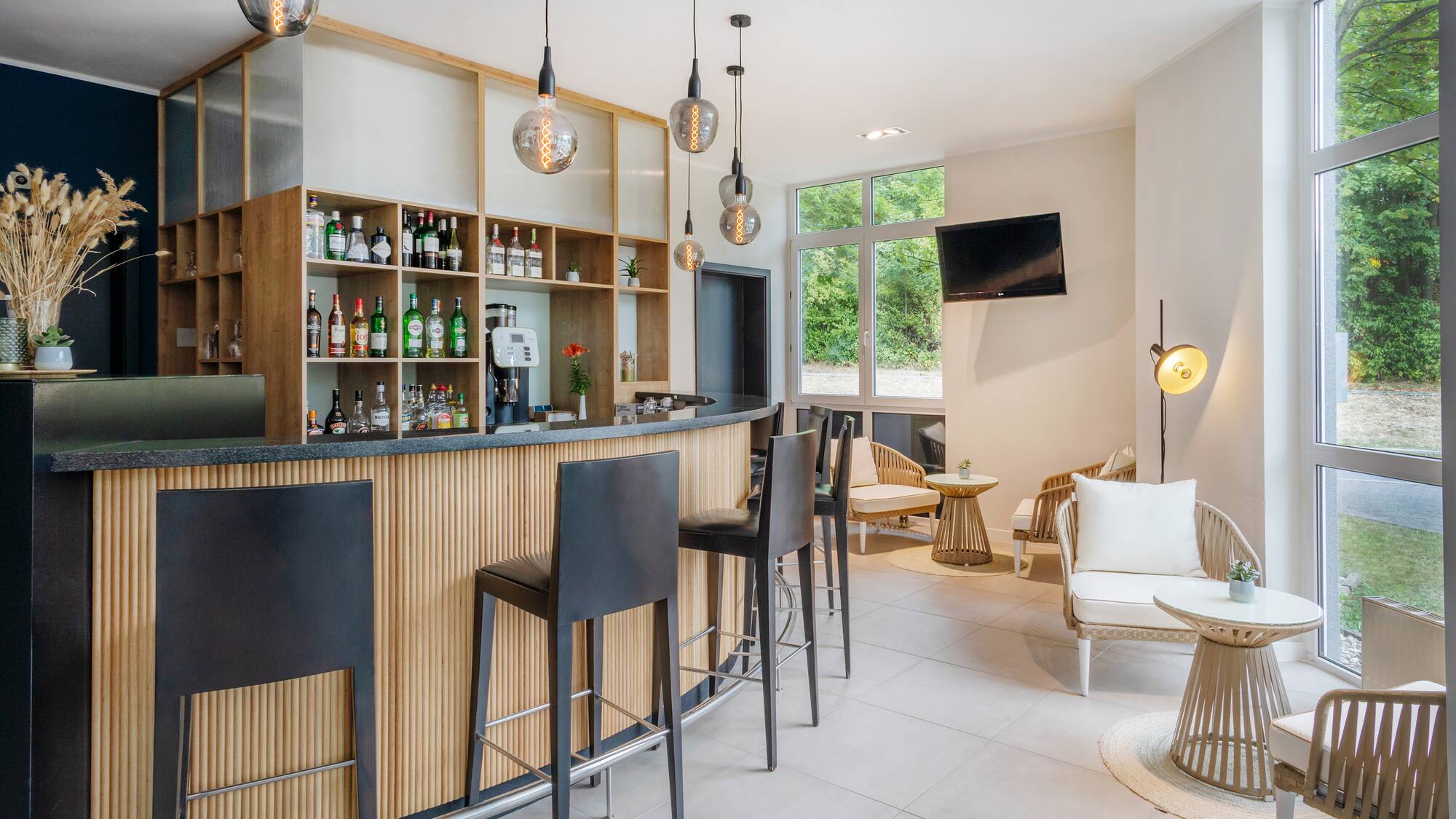 a bar with a counter and chairs