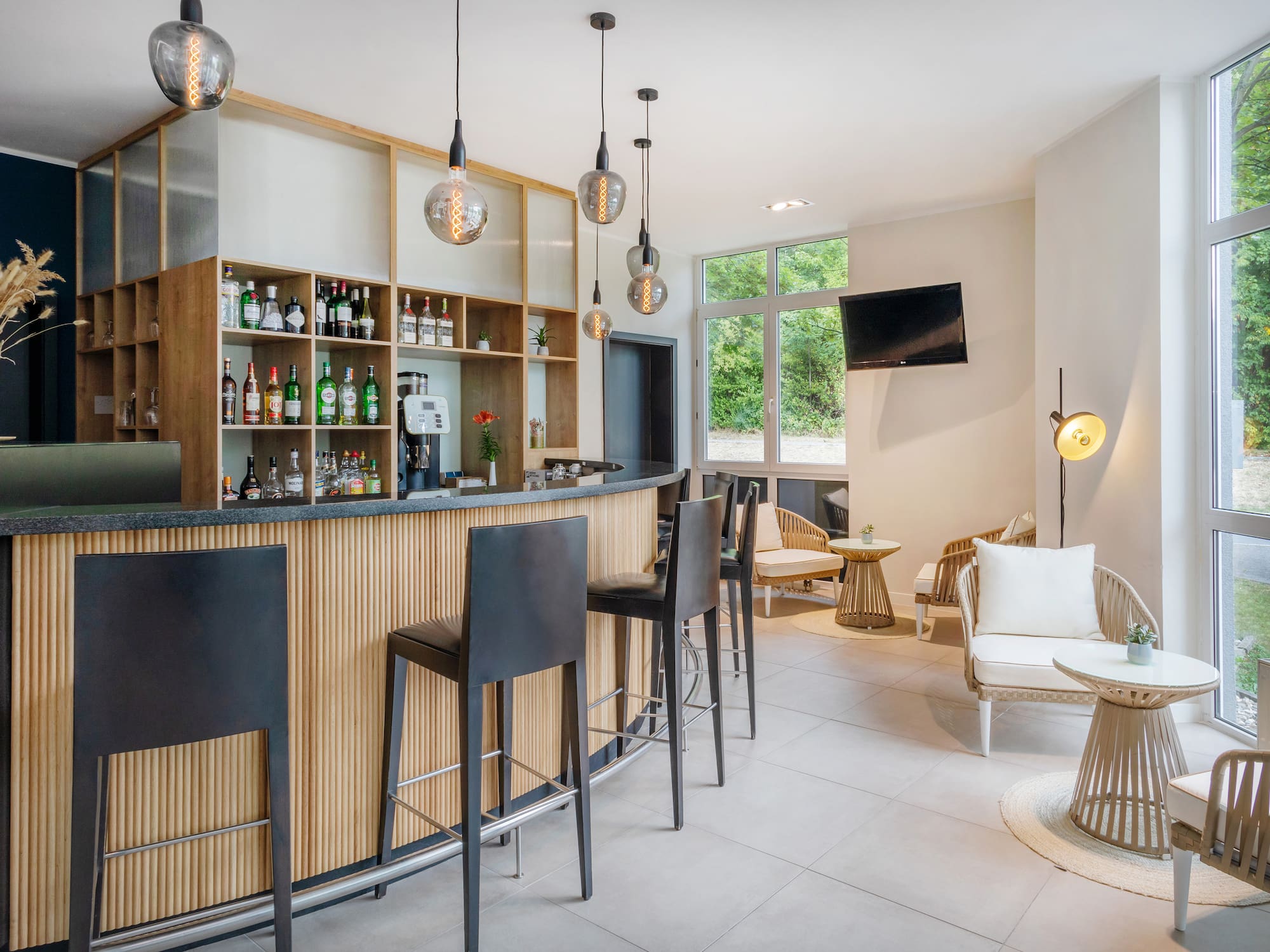 a bar with a counter and chairs