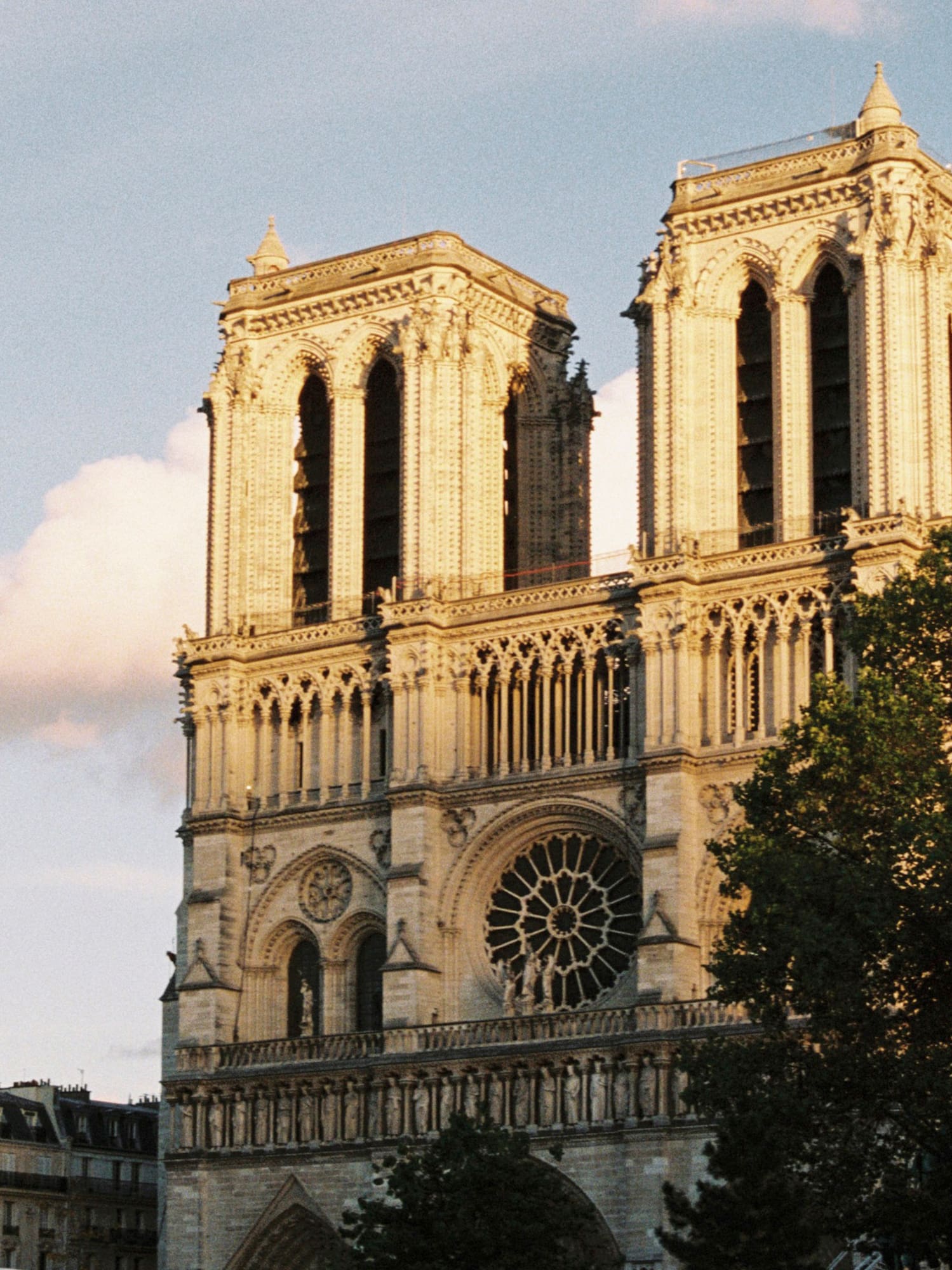 a large building with two towers with Notre Dame de Paris in the background