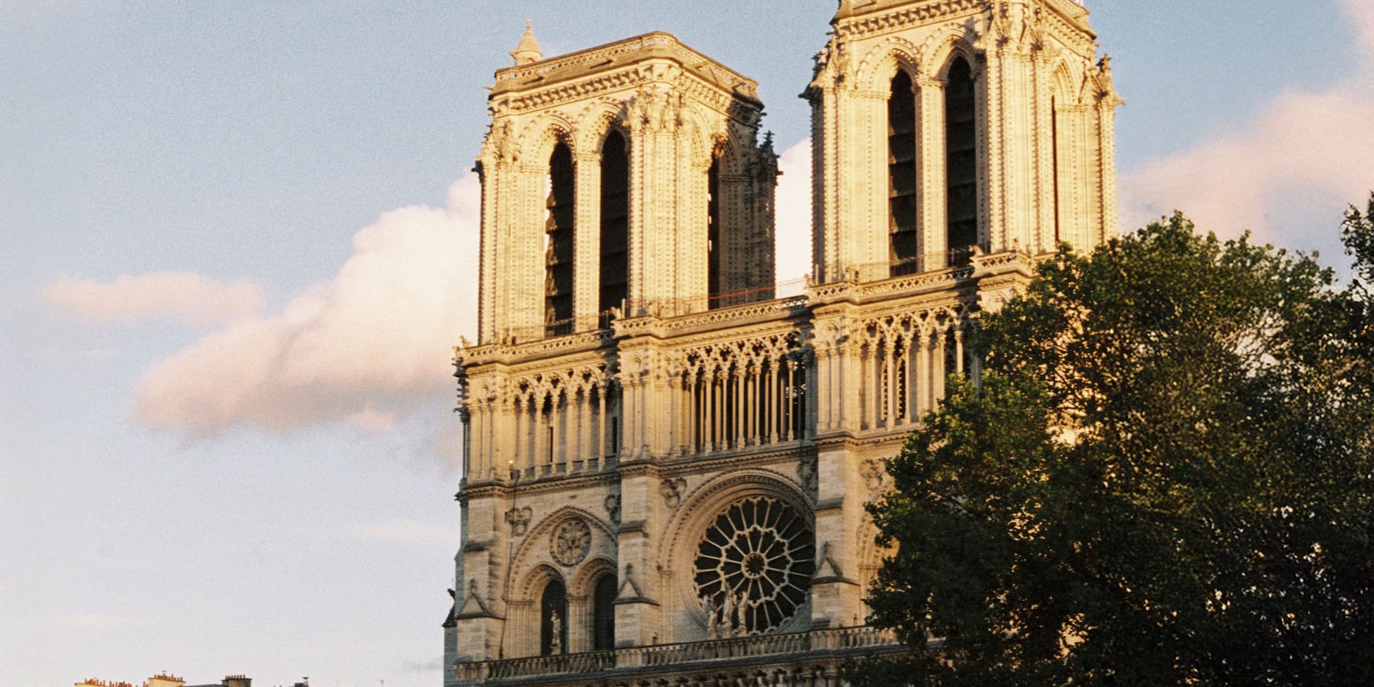 a large building with two towers with Notre Dame de Paris in the background