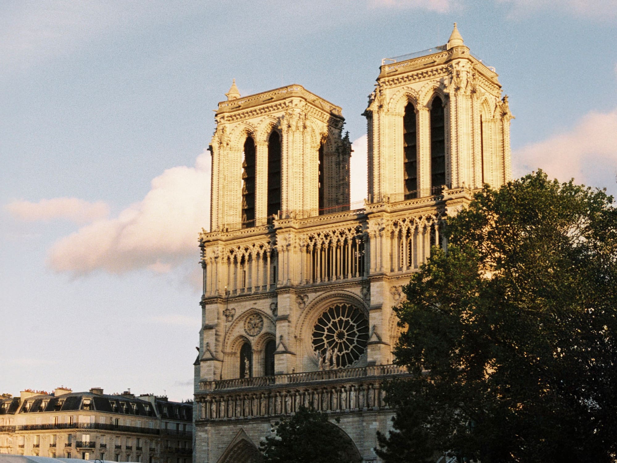 a large building with two towers with Notre Dame de Paris in the background