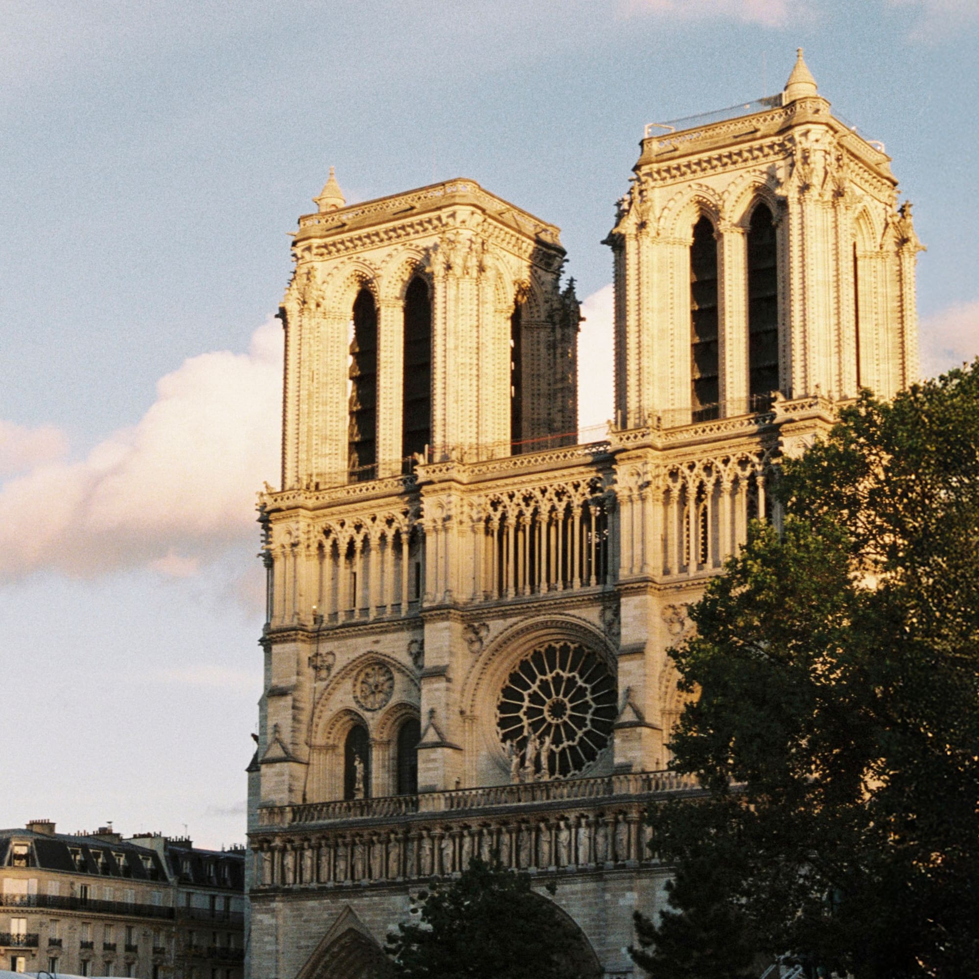 a large building with two towers with Notre Dame de Paris in the background