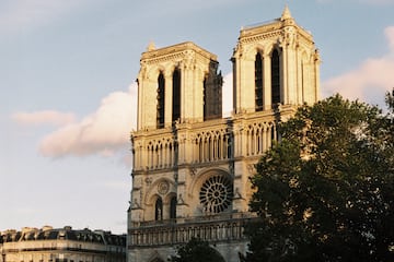 a large building with two towers with Notre Dame de Paris in the background