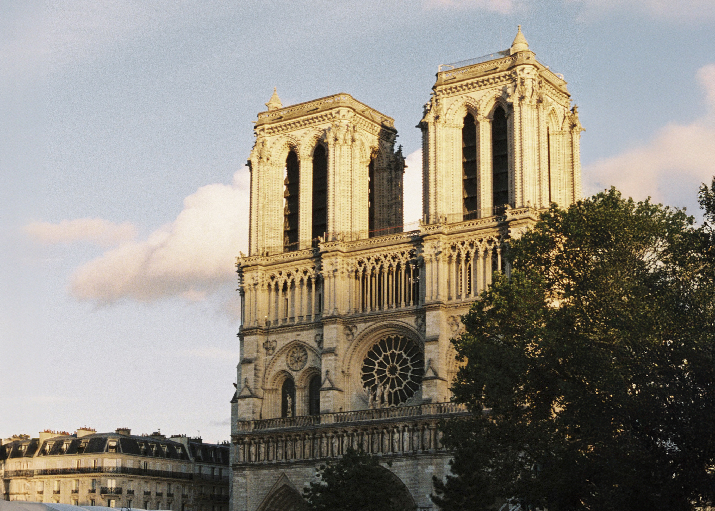 a large building with two towers with Notre Dame de Paris in the background