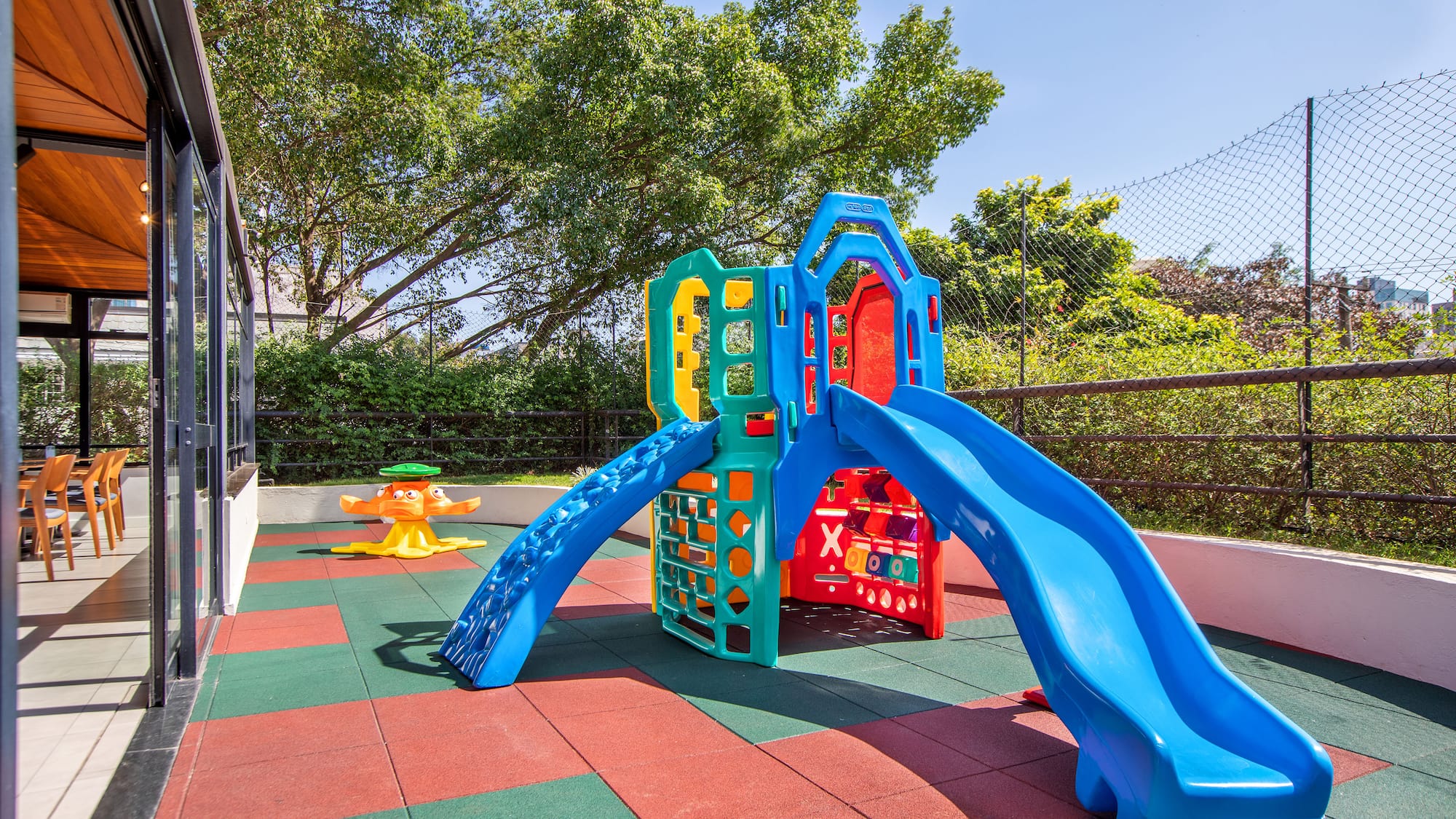 a playground with slide and a swing