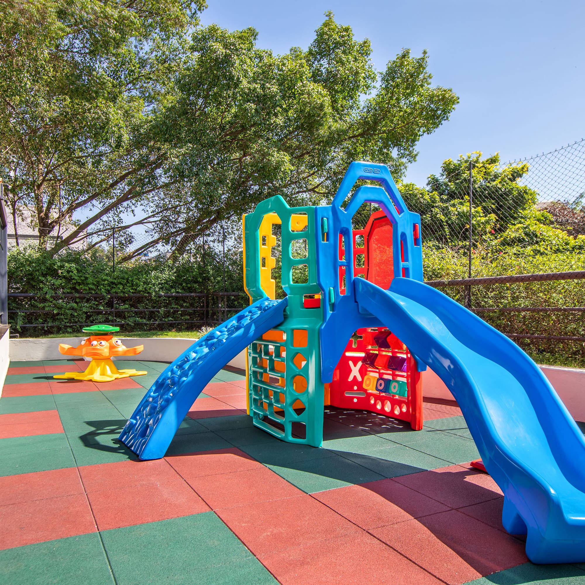a playground with slide and a swing