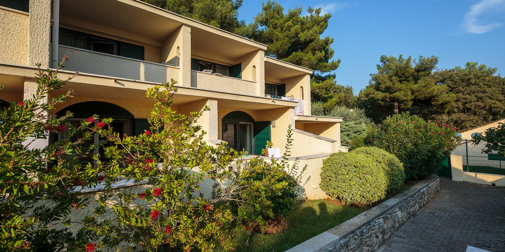 a building with trees and bushes