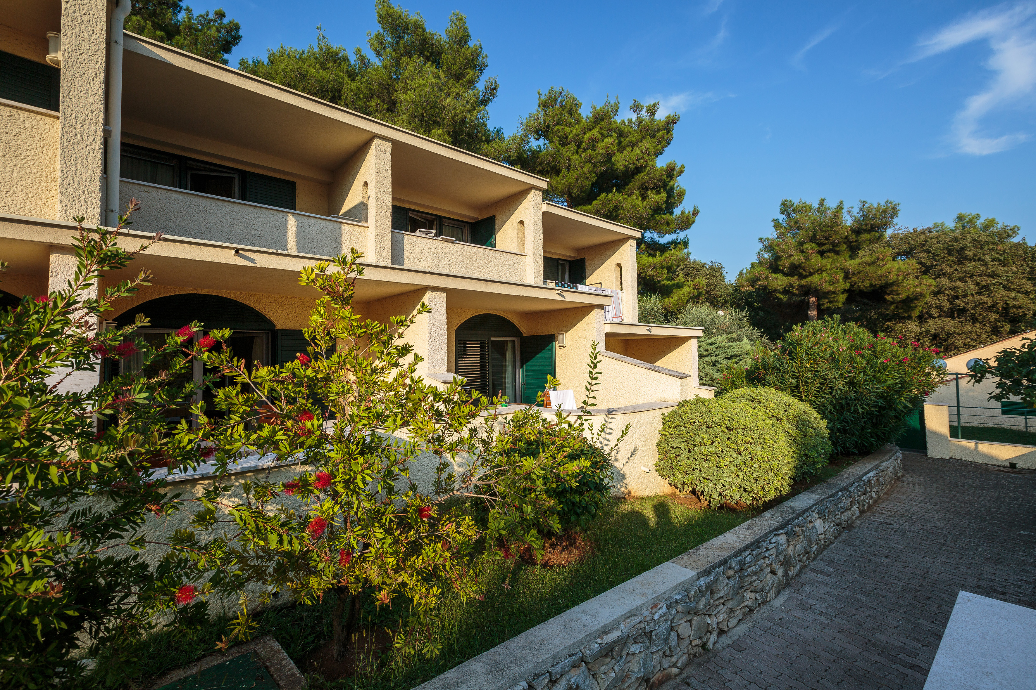 a building with trees and bushes