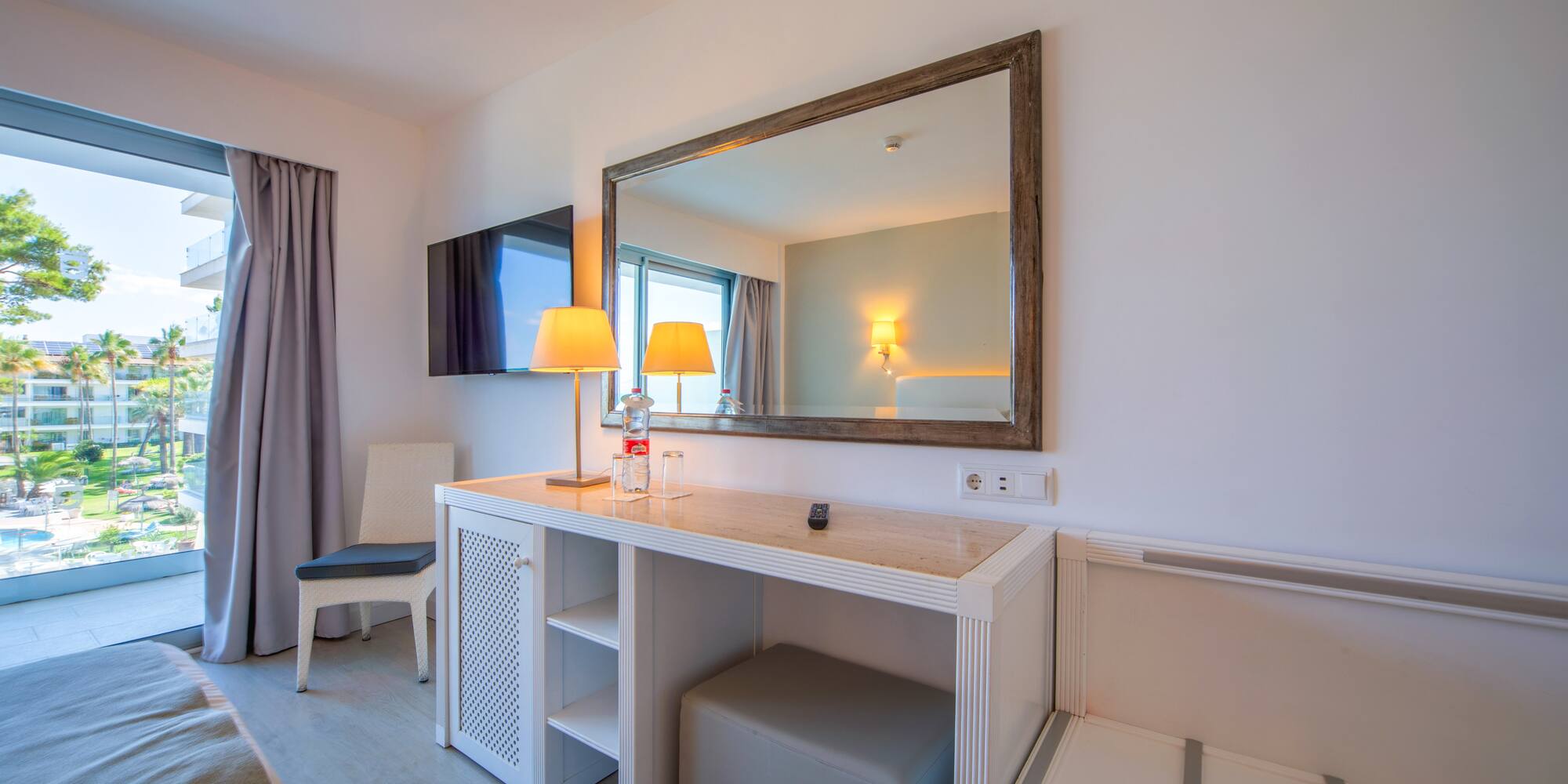 a room with a mirror and a table