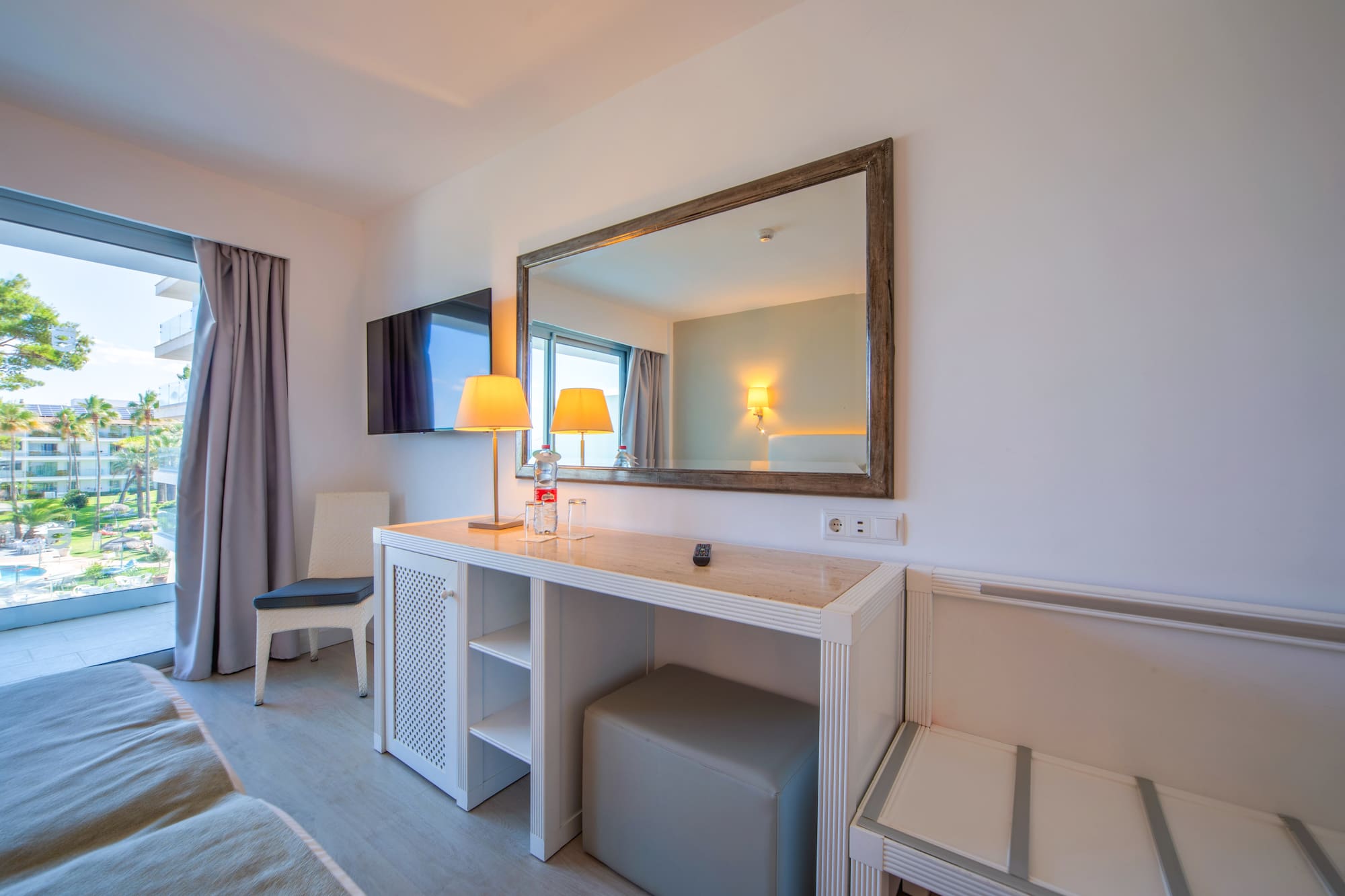 a room with a mirror and a table