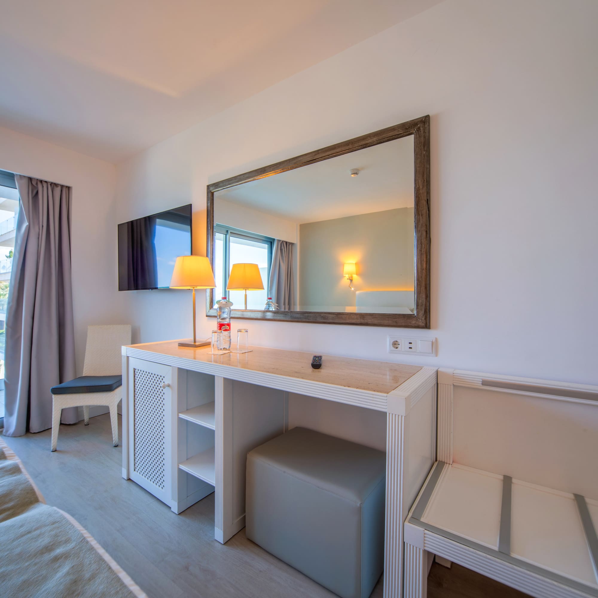 a room with a mirror and a table