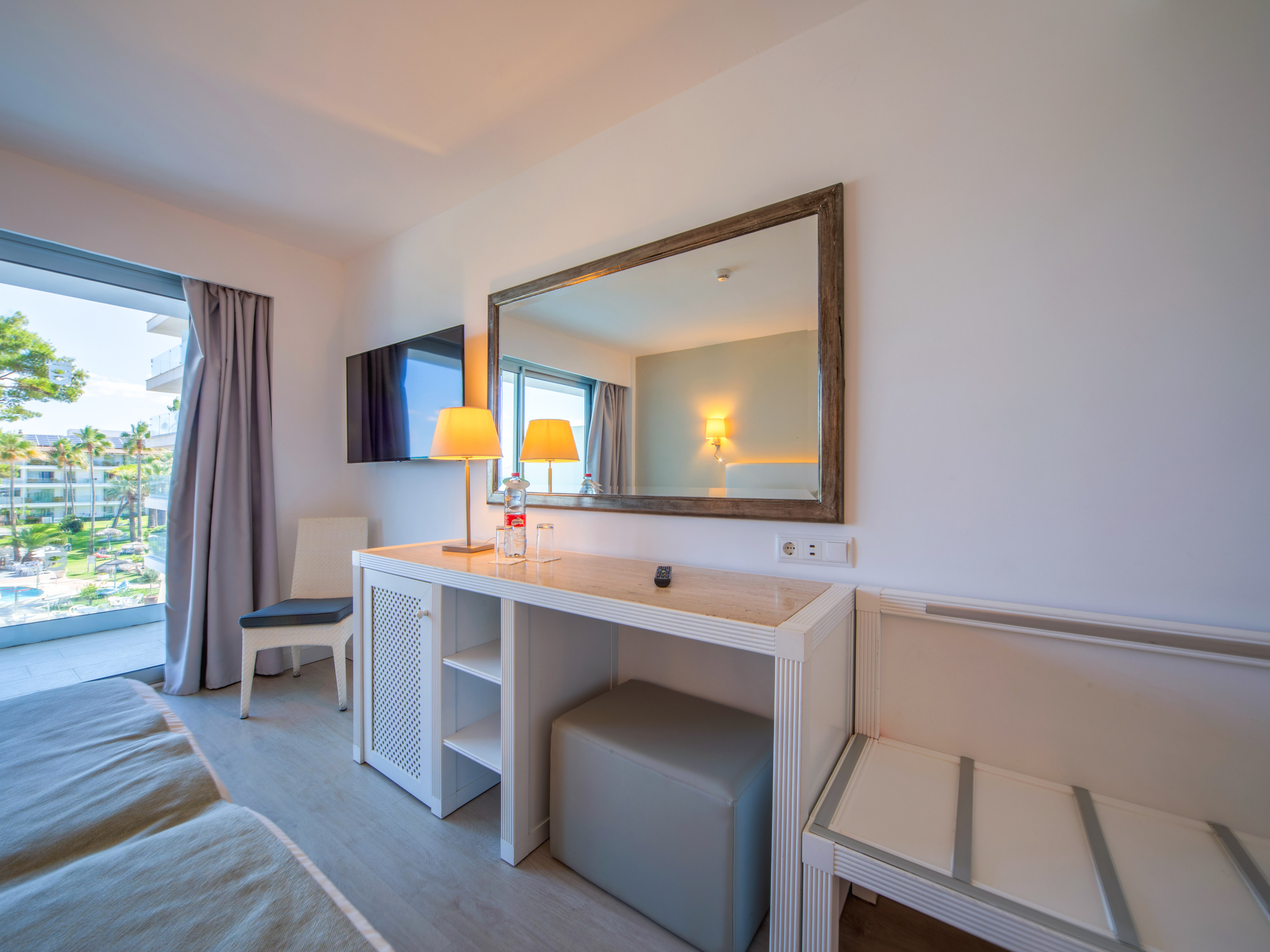 a room with a mirror and a table