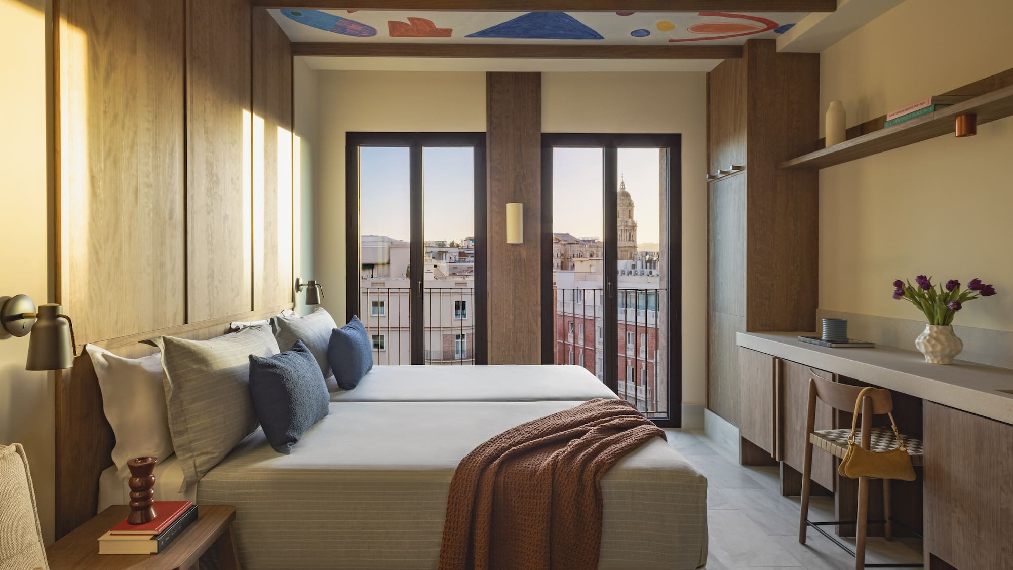 a room with a bed and a television