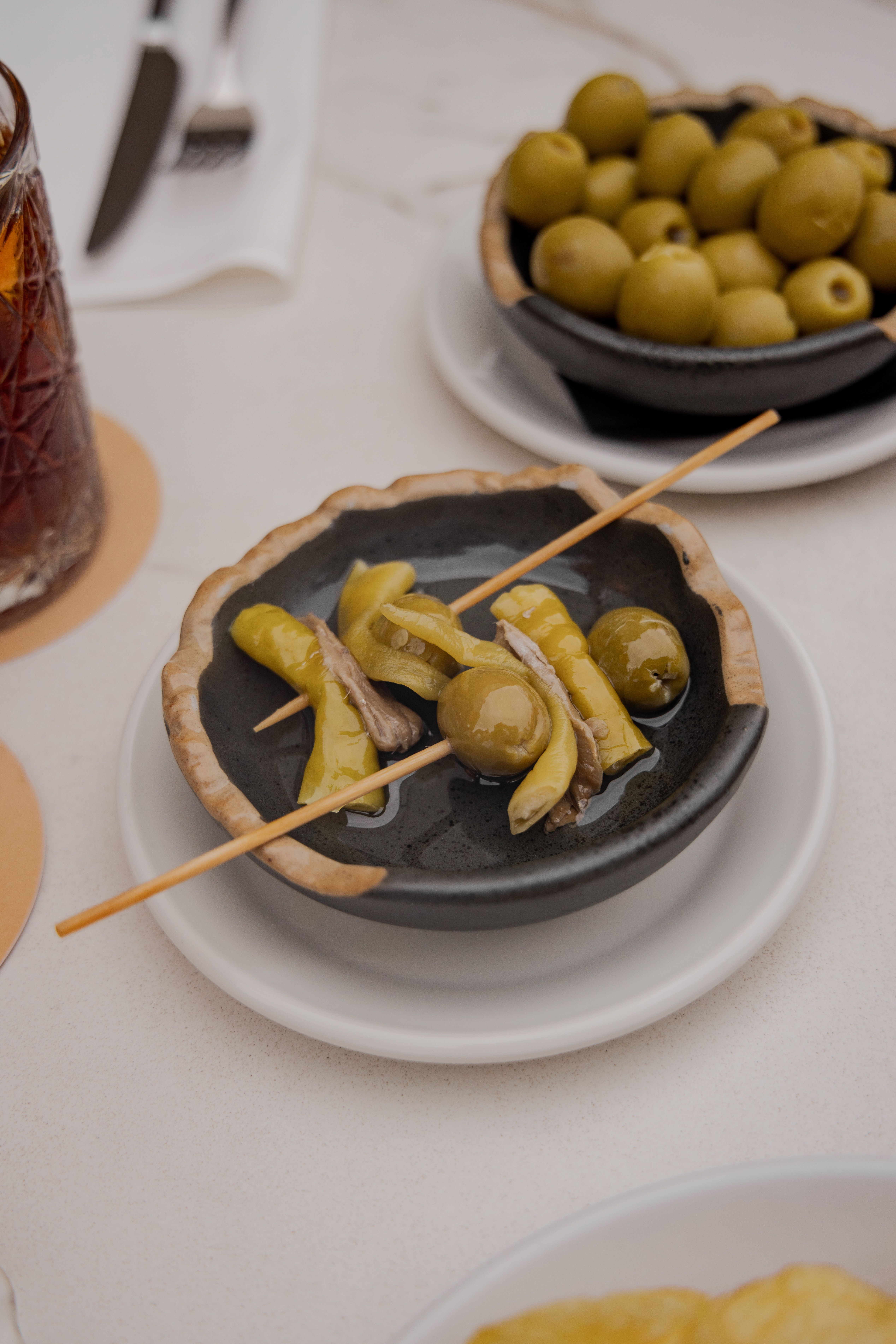 Gilda skewers with olives, pickled peppers, anchovies. Side of green olives.