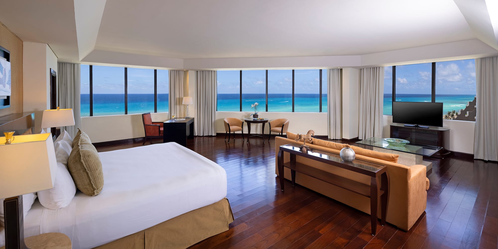 a room with a large window overlooking the ocean