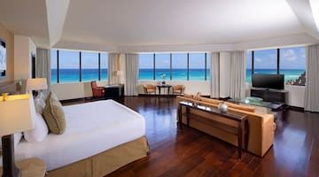 a room with a large window overlooking the ocean