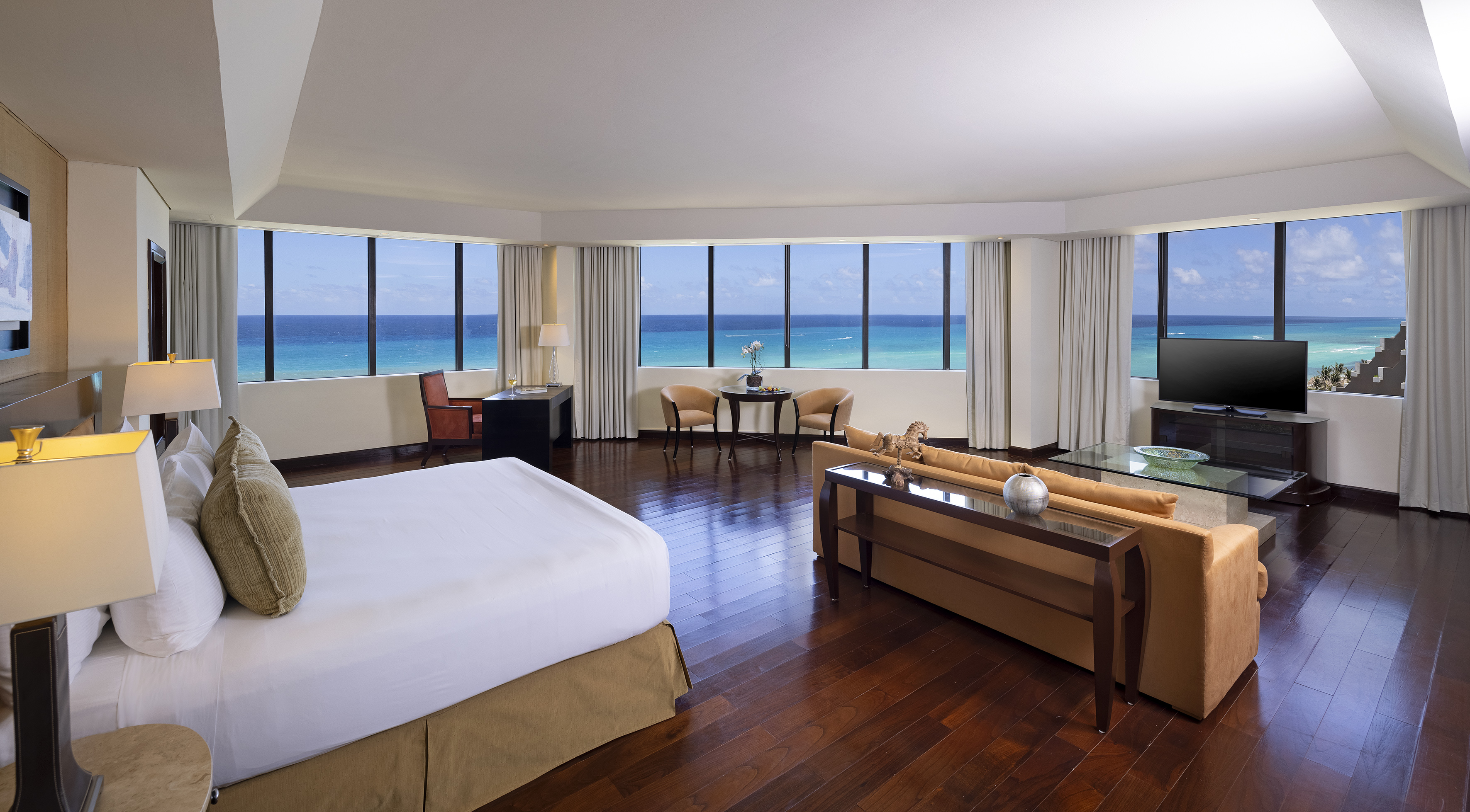 a room with a large window overlooking the ocean