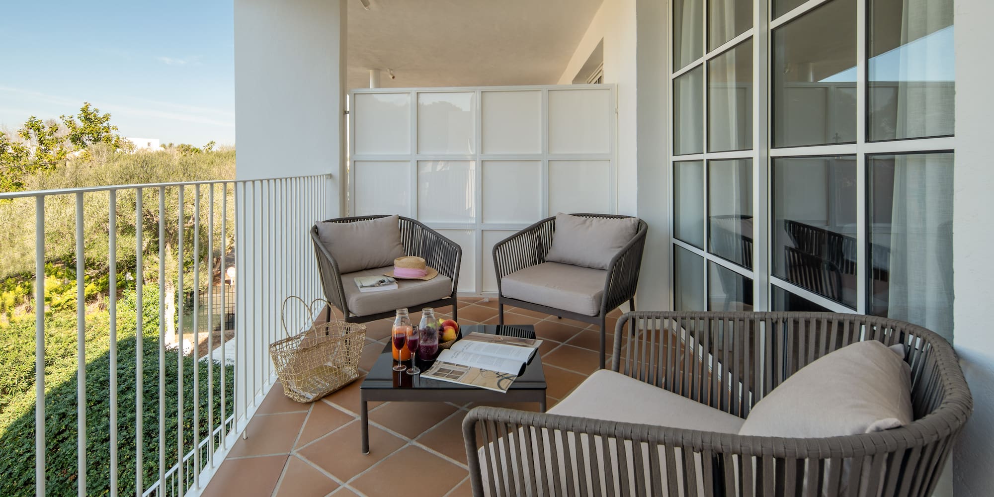 a patio with chairs and a table