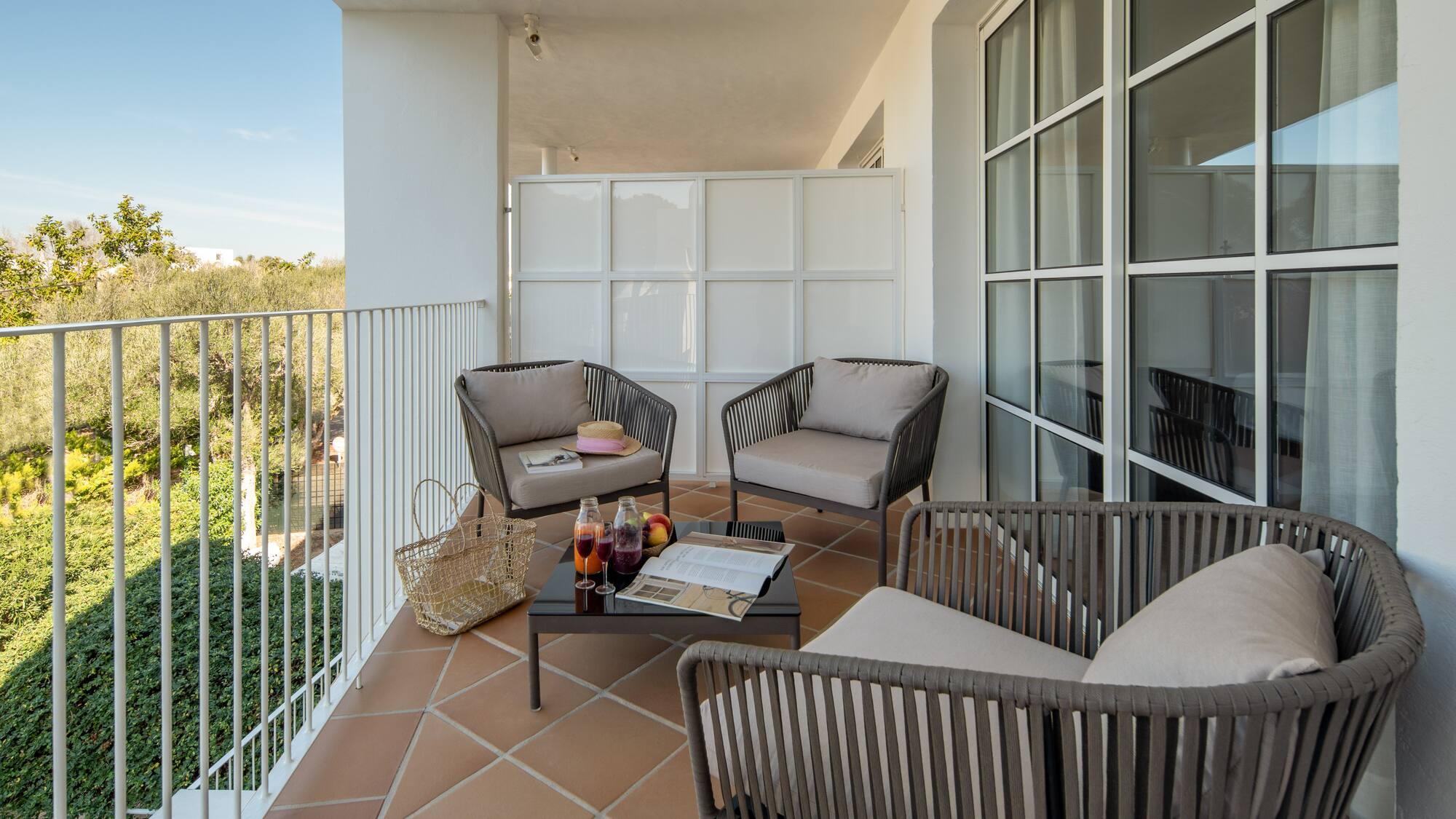 a patio with chairs and a table