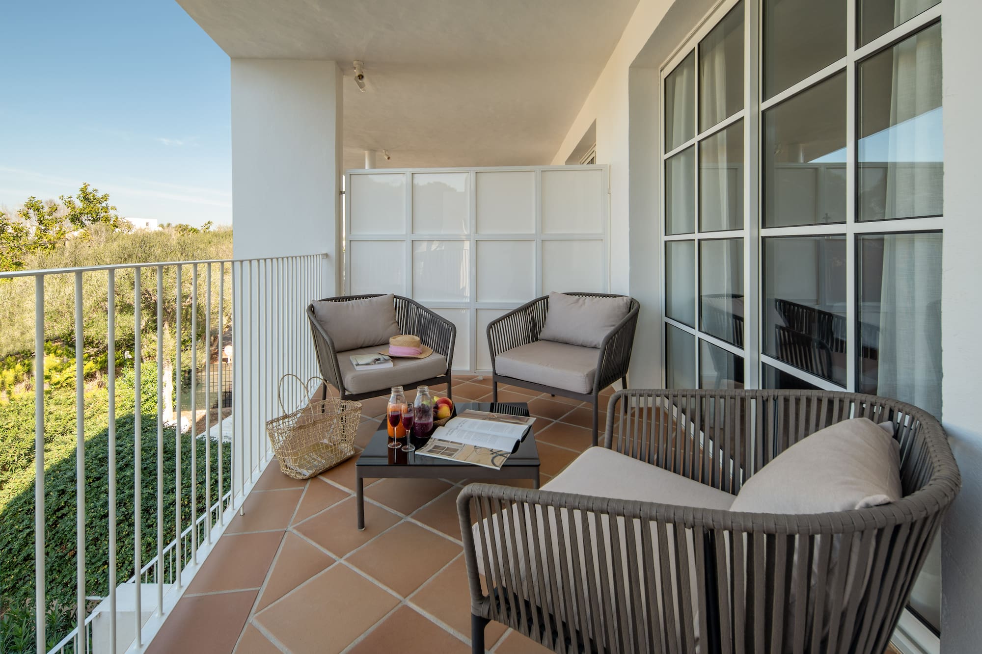 a patio with chairs and a table