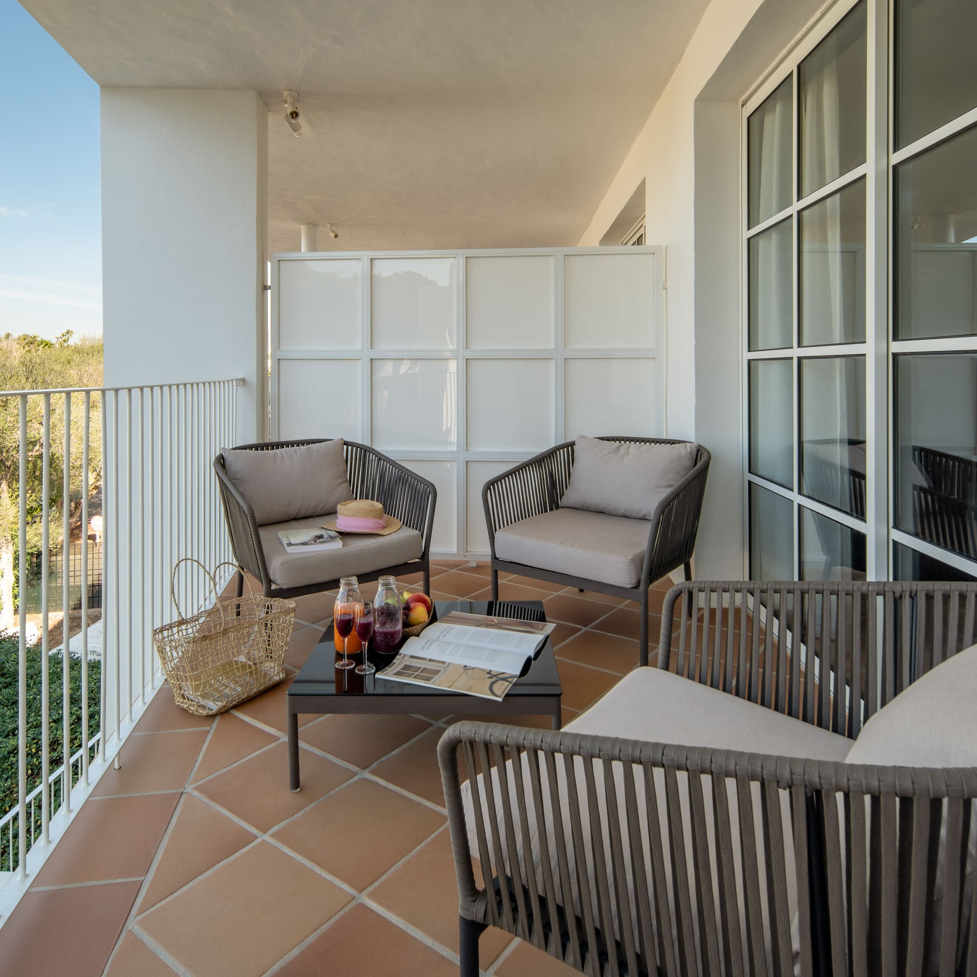 a patio with chairs and a table