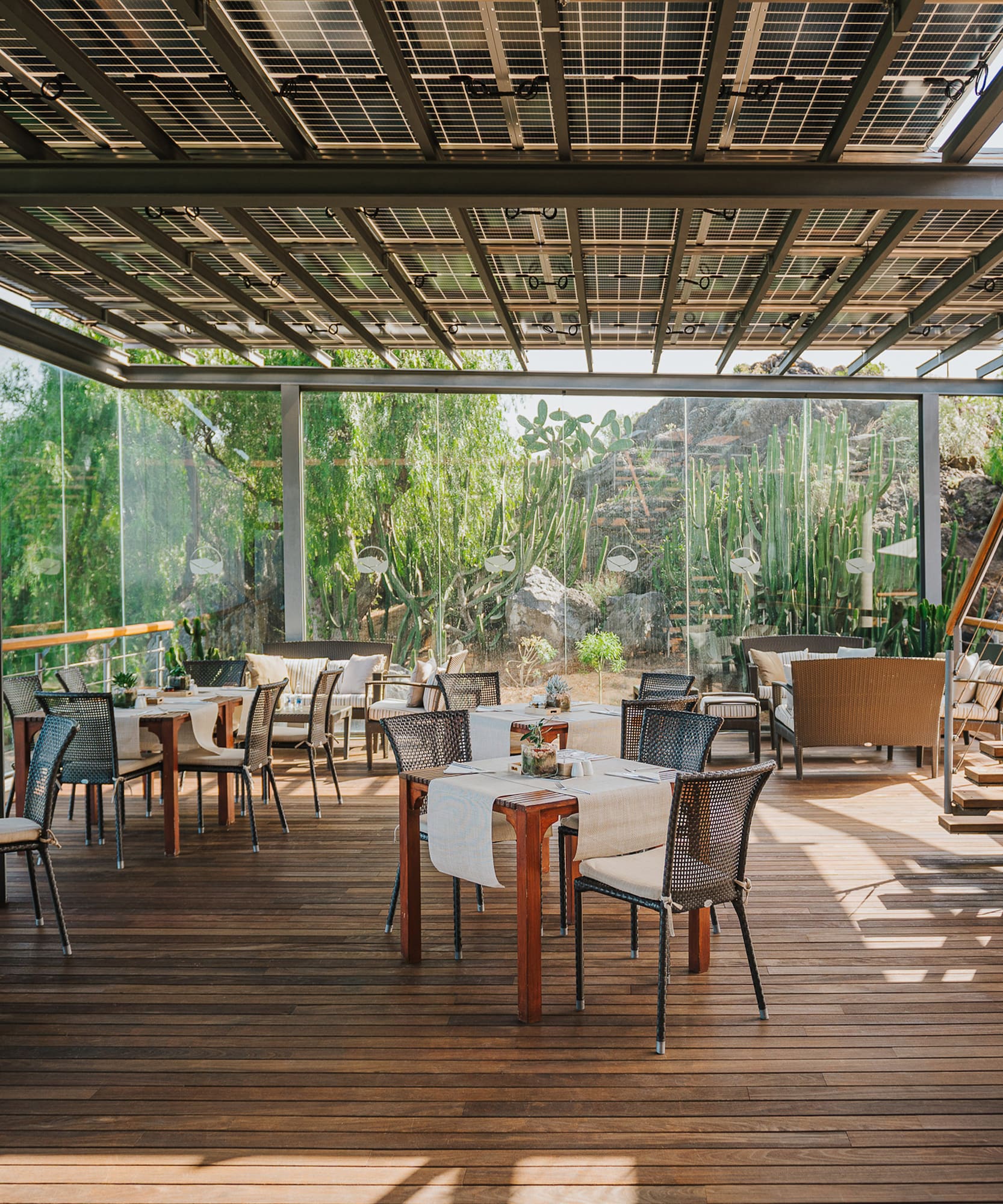 a patio with tables and chairs