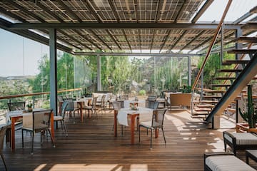 a patio with tables and chairs