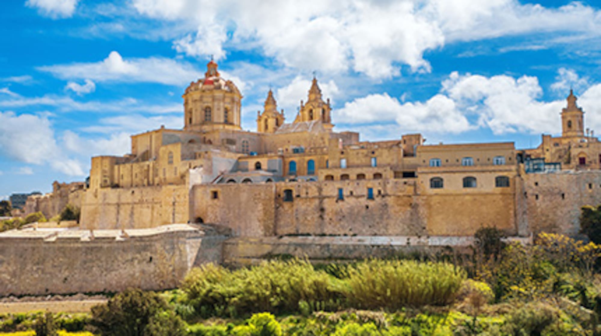 Mdina, Malta: Historic fortified city with Baroque cathedral, blue sky.