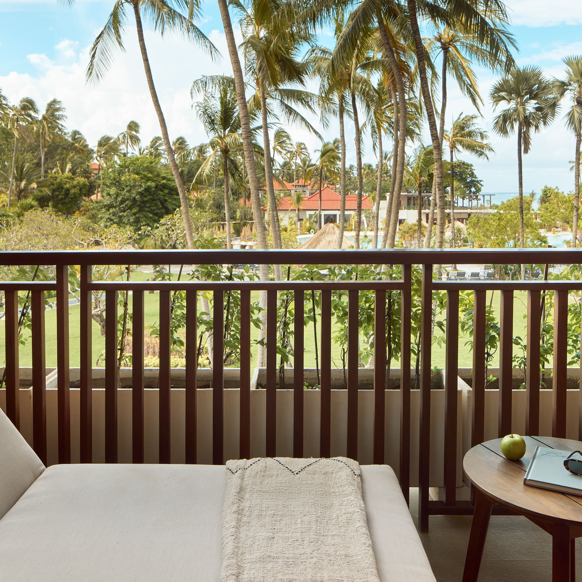 a balcony with a couch and a table