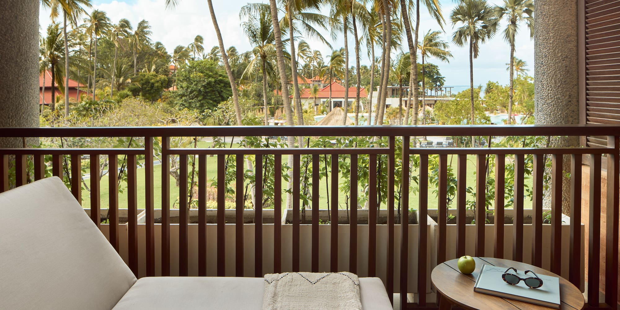 a balcony with a couch and a table