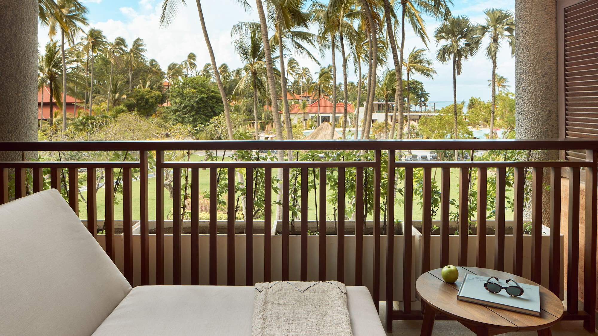 a balcony with a couch and a table