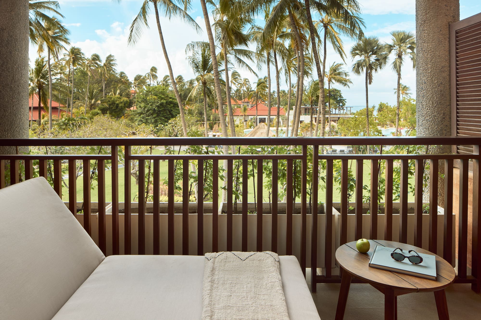 a balcony with a couch and a table