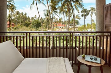 a balcony with a couch and a table