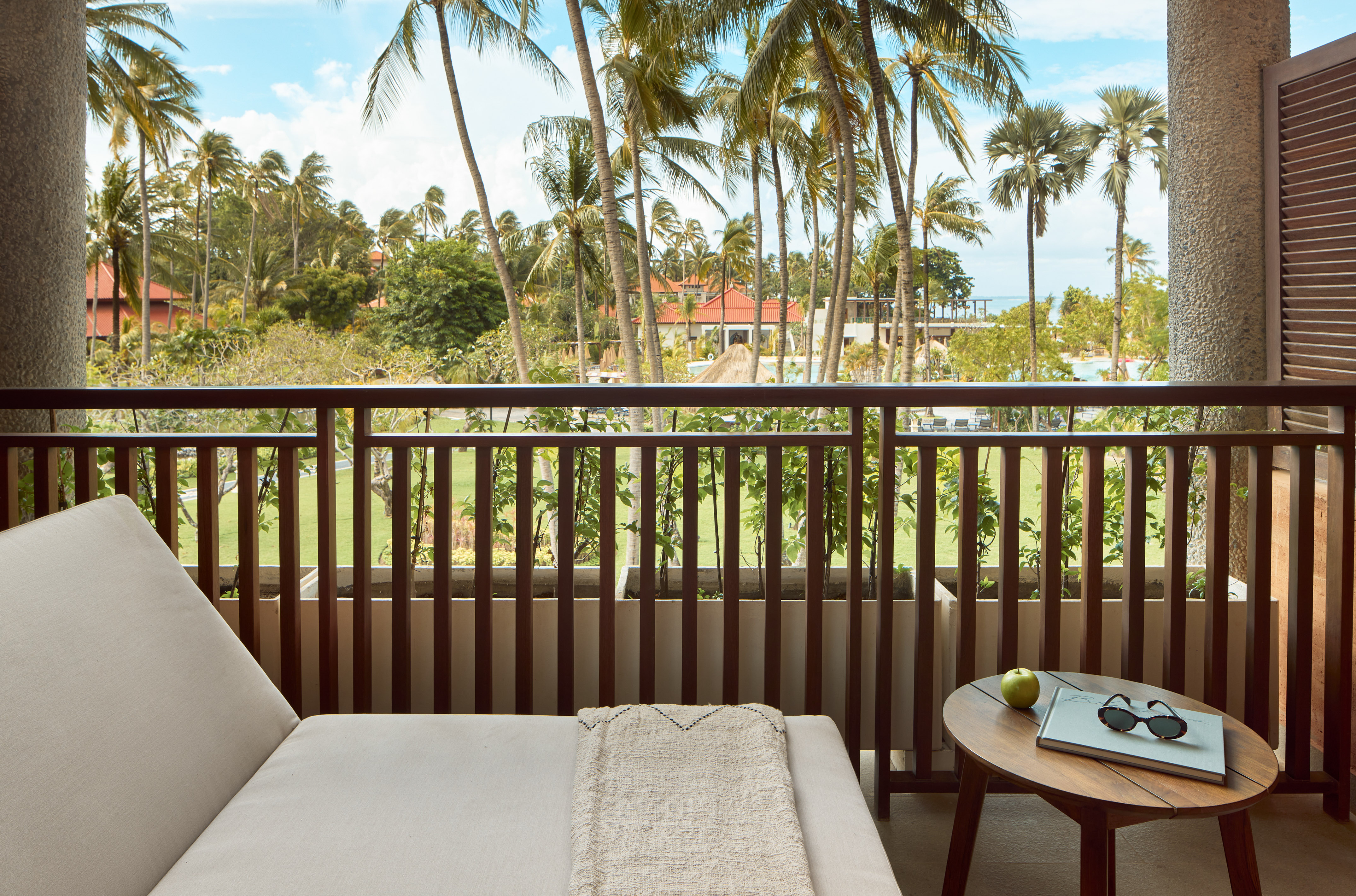 a balcony with a couch and a table