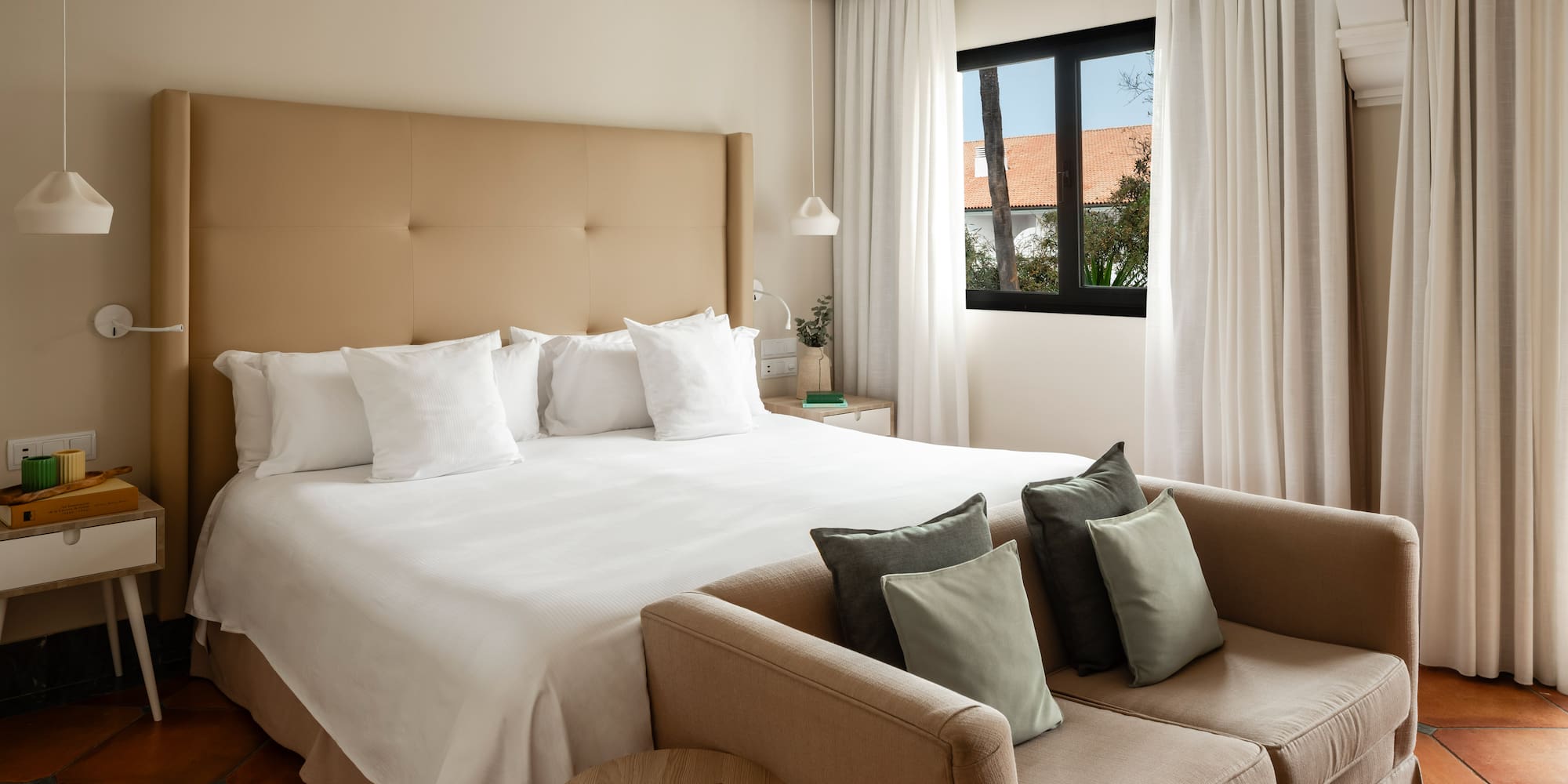 a bed and couch in a hotel room