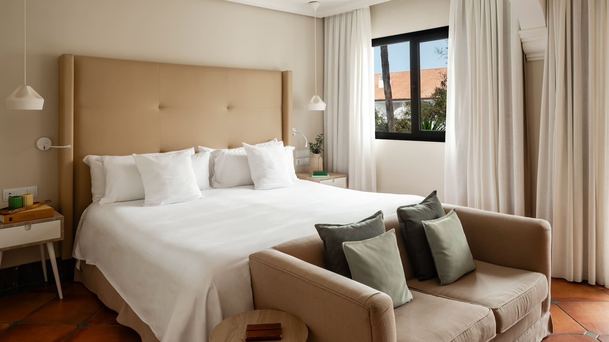 a bed and couch in a hotel room