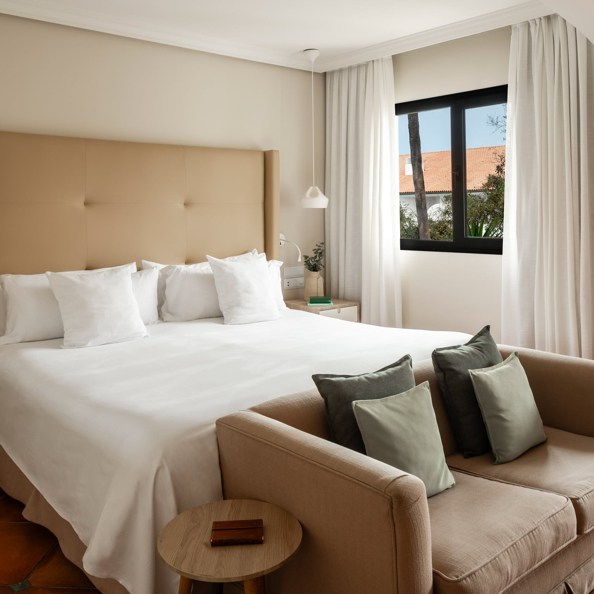 a bed and couch in a hotel room