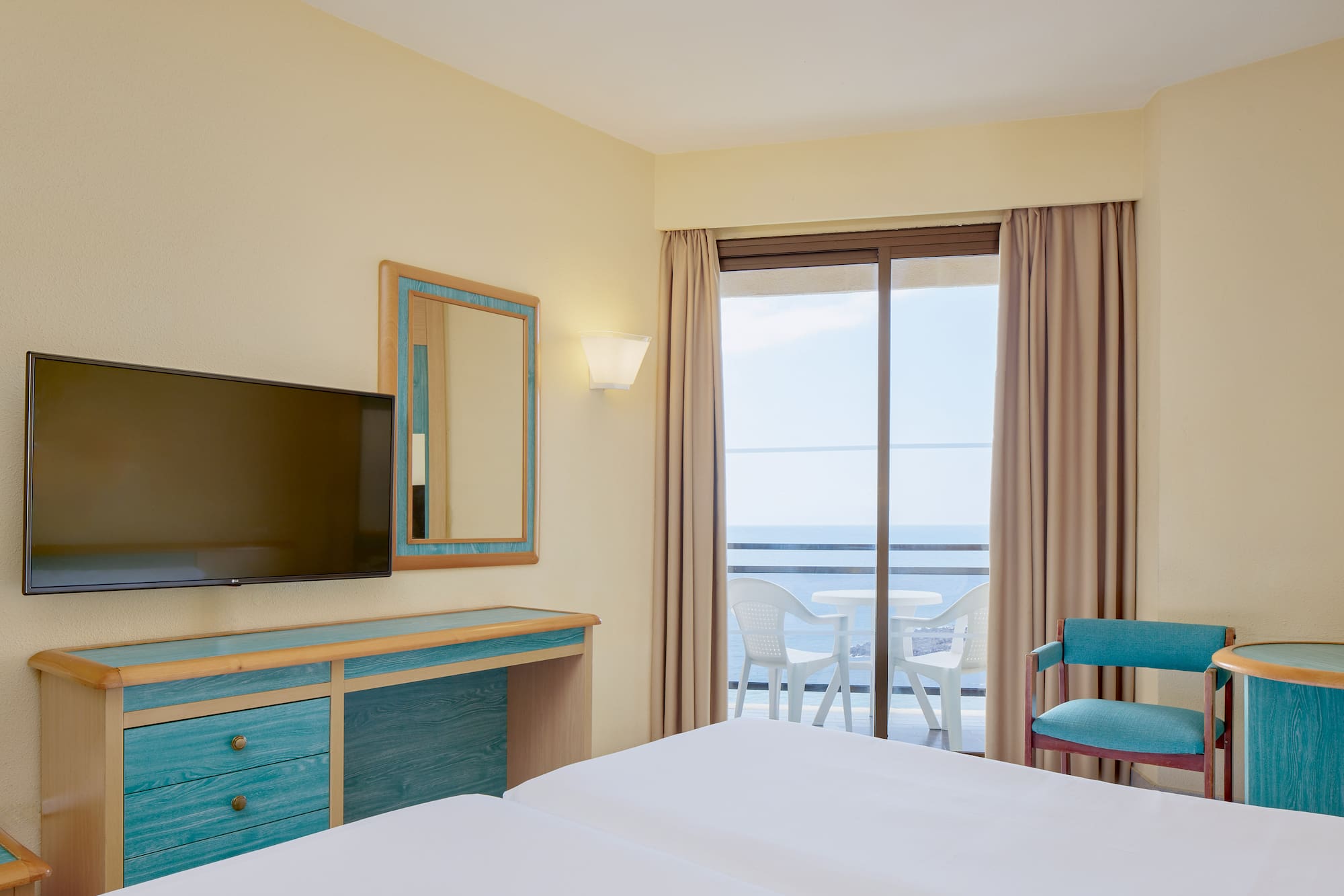 a room with a television and a table