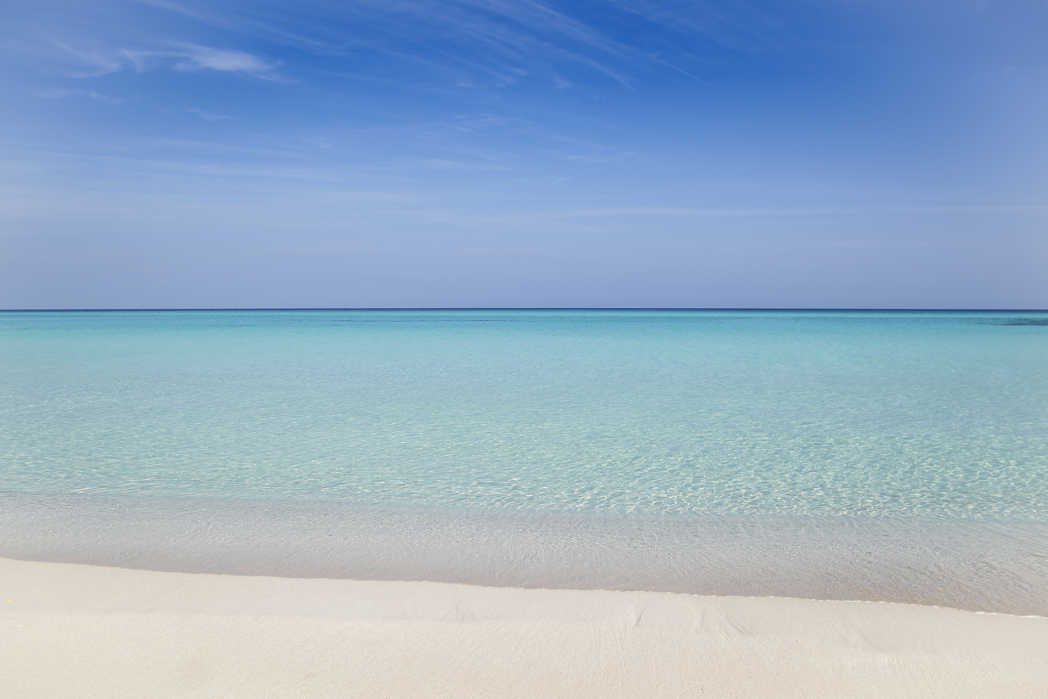 a beach with clear blue water