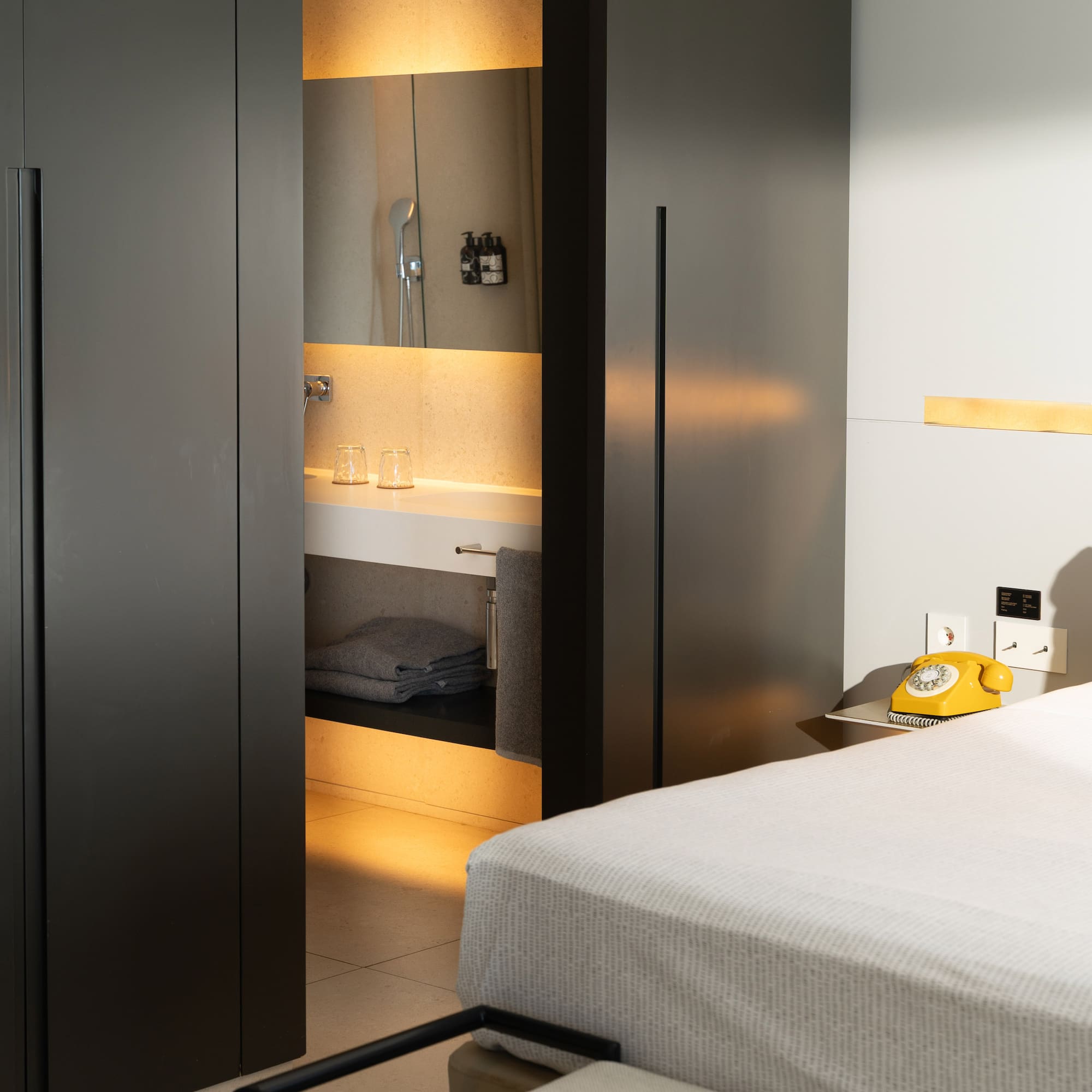 a room with a bed and a sink