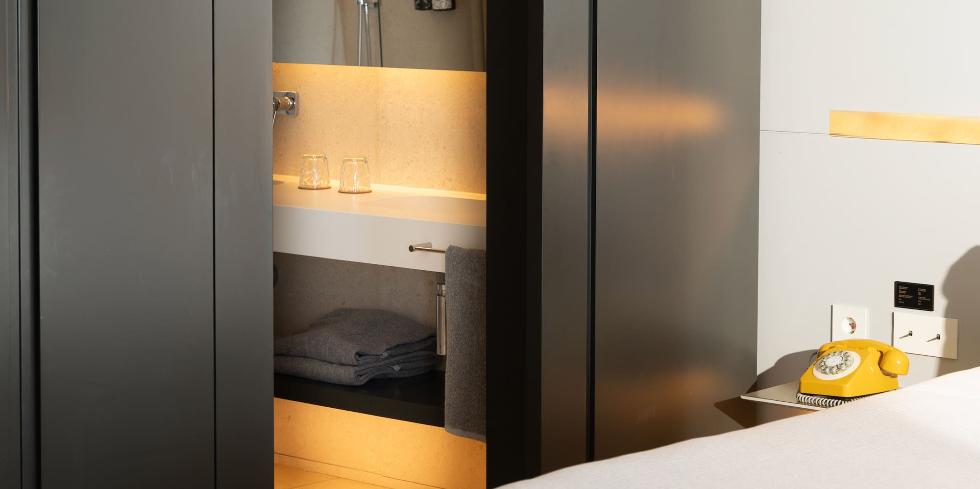 a room with a bed and a sink